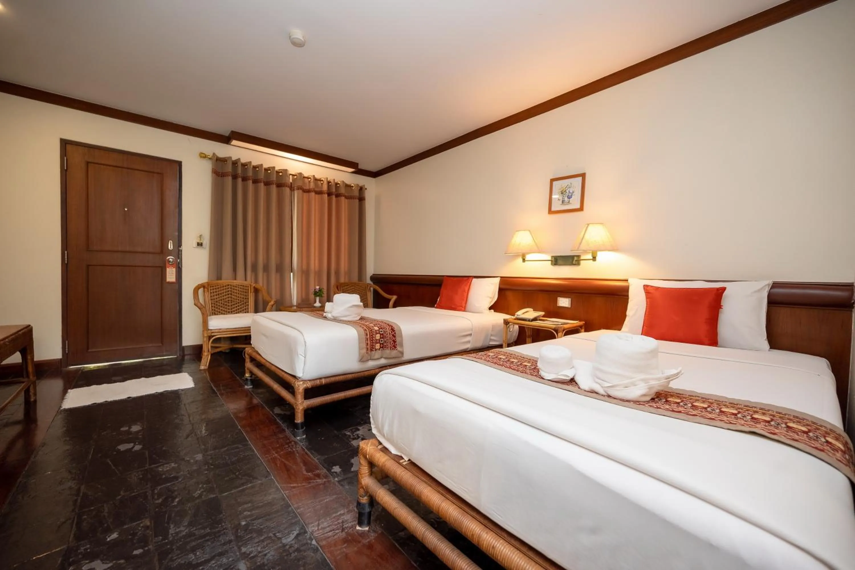 Bed in Comsaed River Kwai Resort