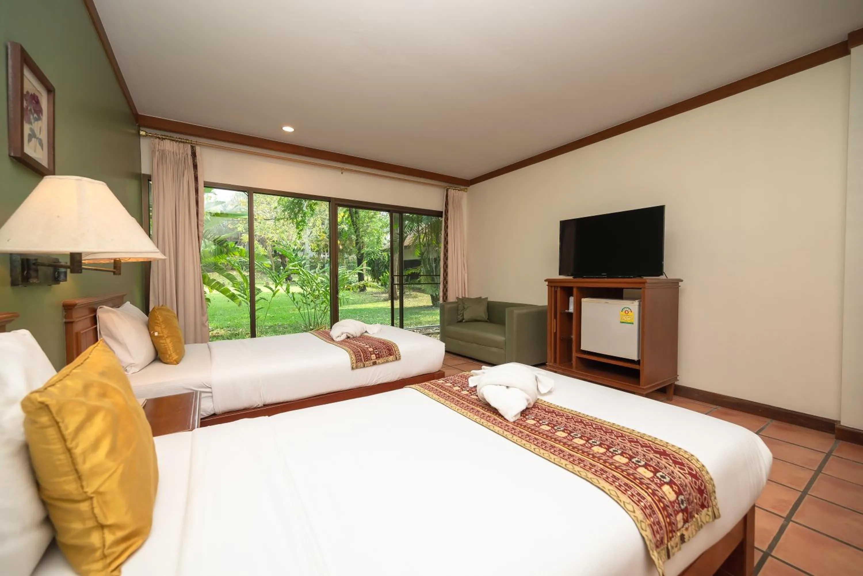Photo of the whole room, Bed in Comsaed River Kwai Resort