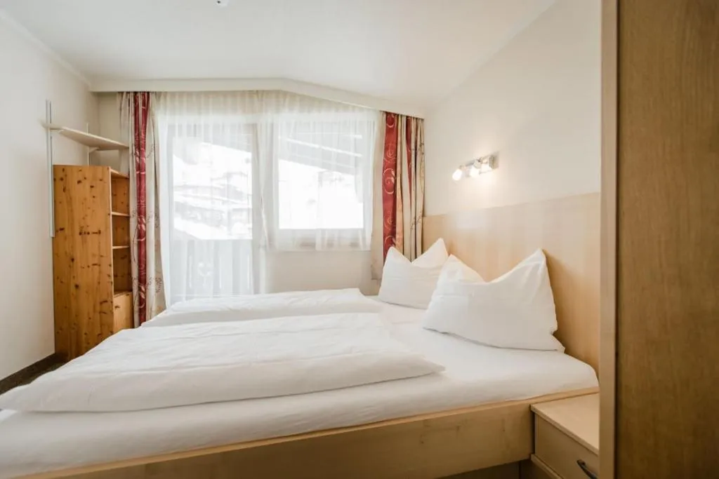 Bedroom, Bed in Aparthotel Dorfplatzl Garni Apartments & B&B