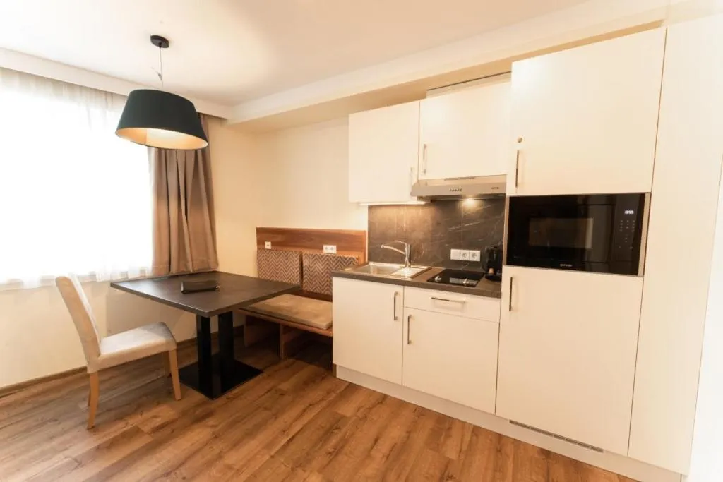 Kitchen or kitchenette in Aparthotel Dorfplatzl Garni Apartments & B&B
