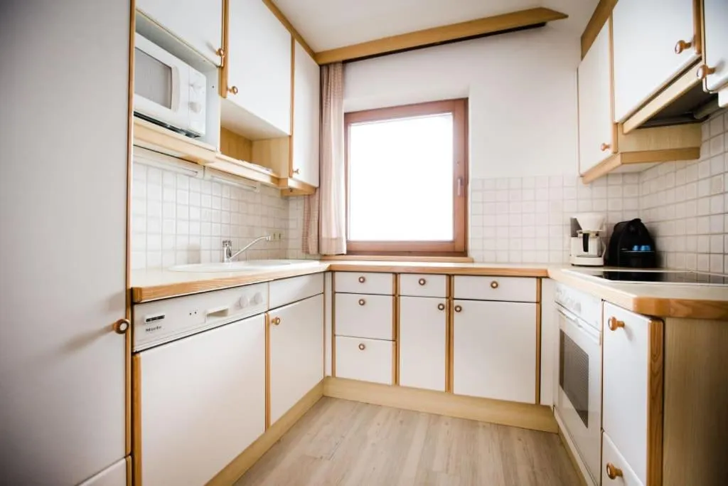 Kitchen or kitchenette in Aparthotel Dorfplatzl Garni Apartments & B&B