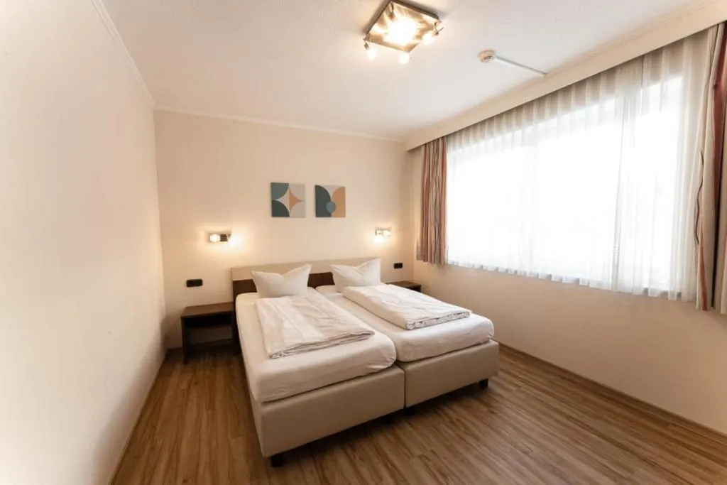Bedroom, Bed in Aparthotel Dorfplatzl Garni Apartments & B&B