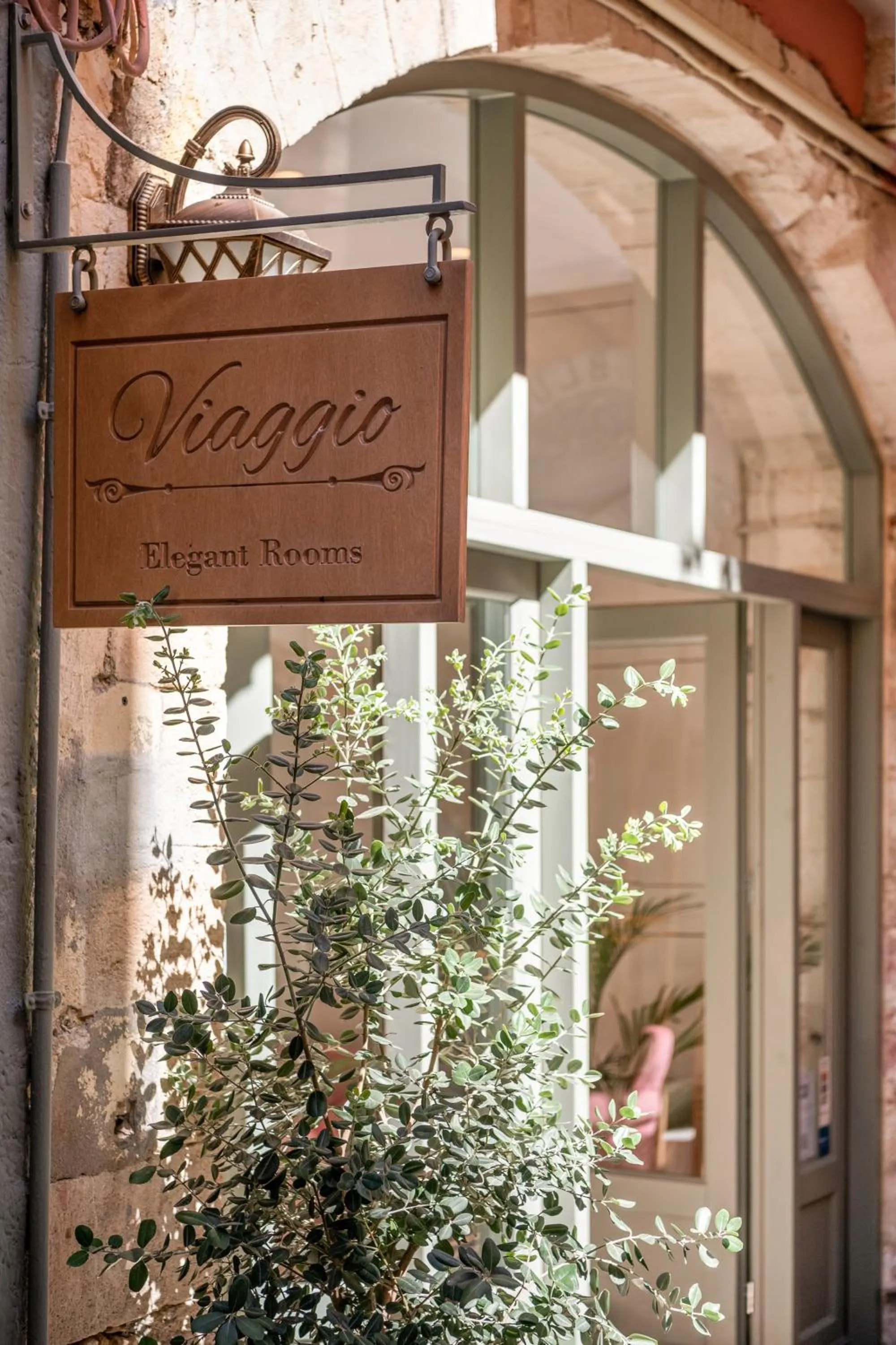 Property logo or sign in Viaggio Elegant Rooms
