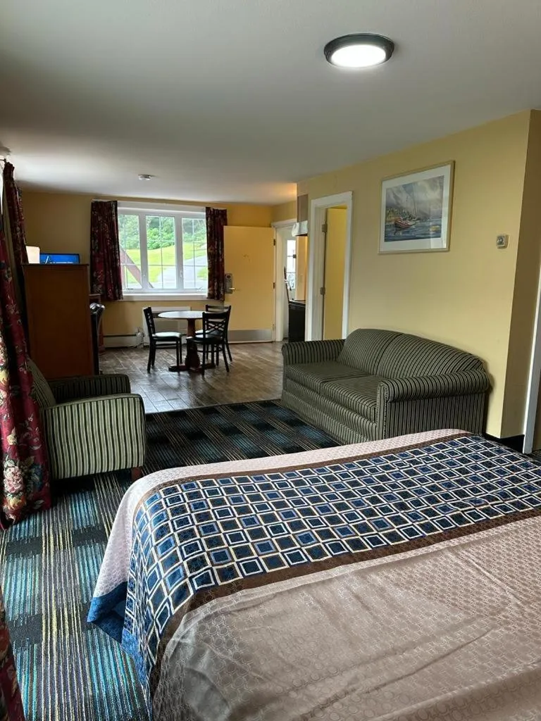 Bed in Swiss Chalets Village Inn