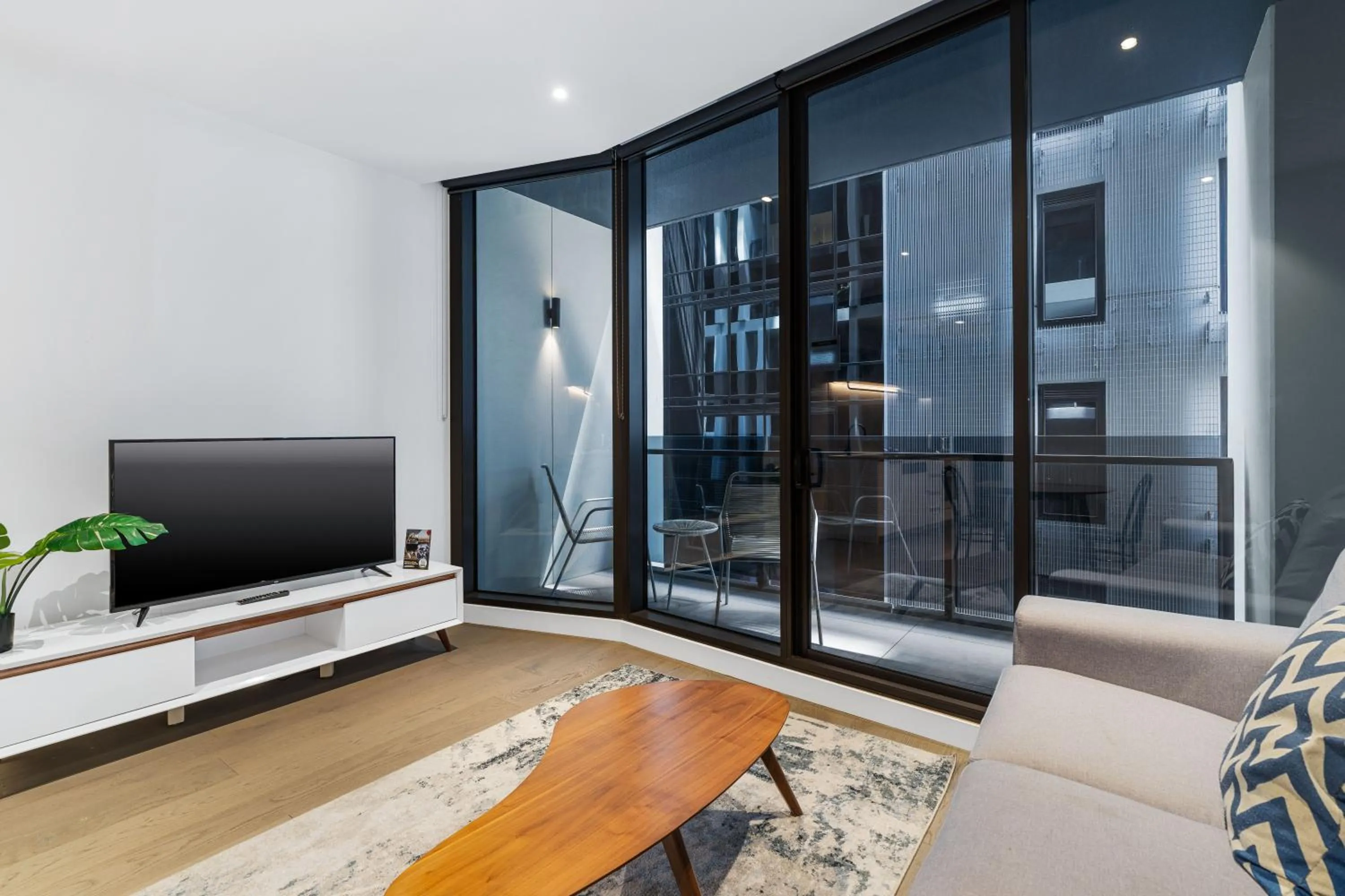TV and multimedia in The Eminence Apartments by CLLIX