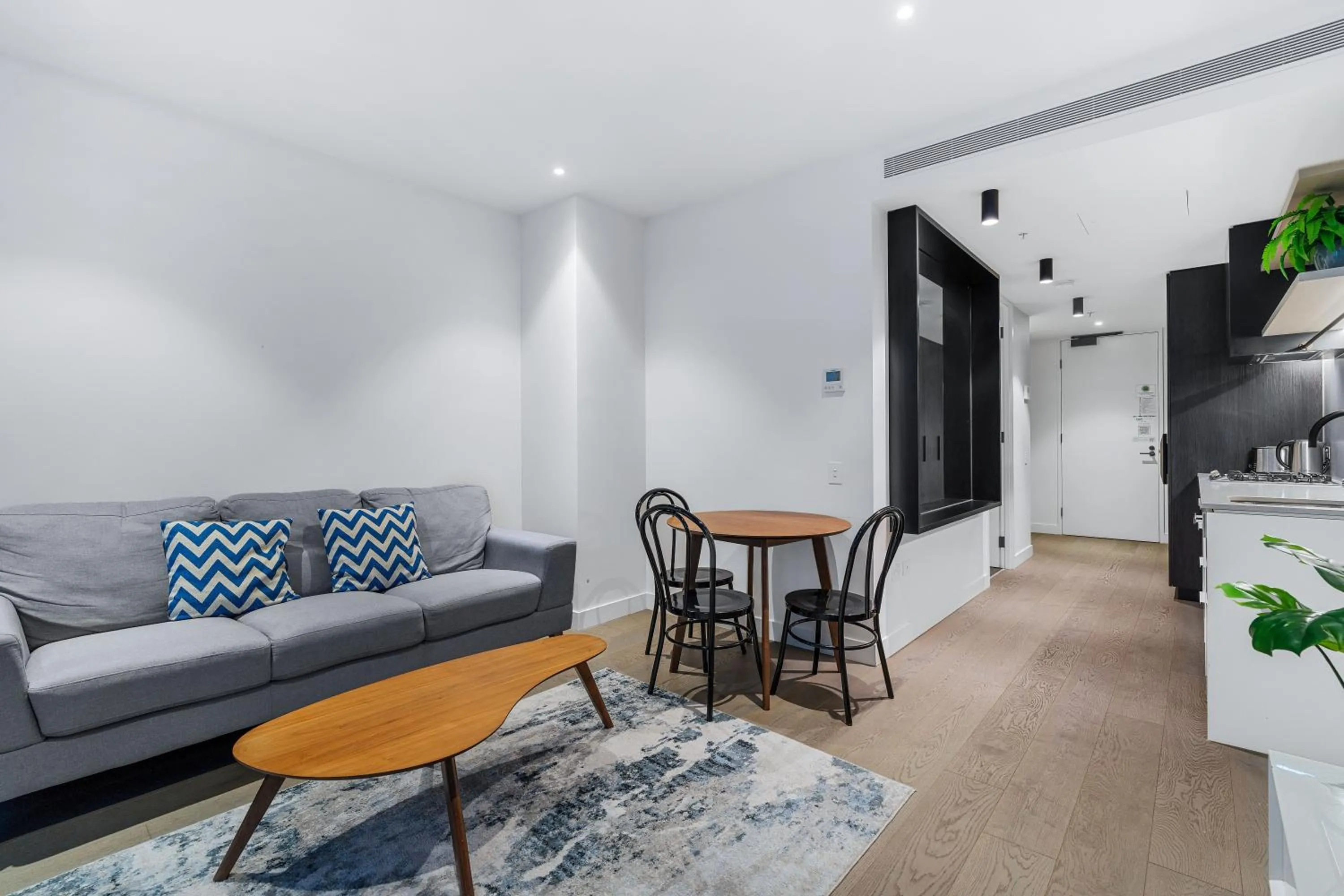 Living room in The Eminence Apartments by CLLIX
