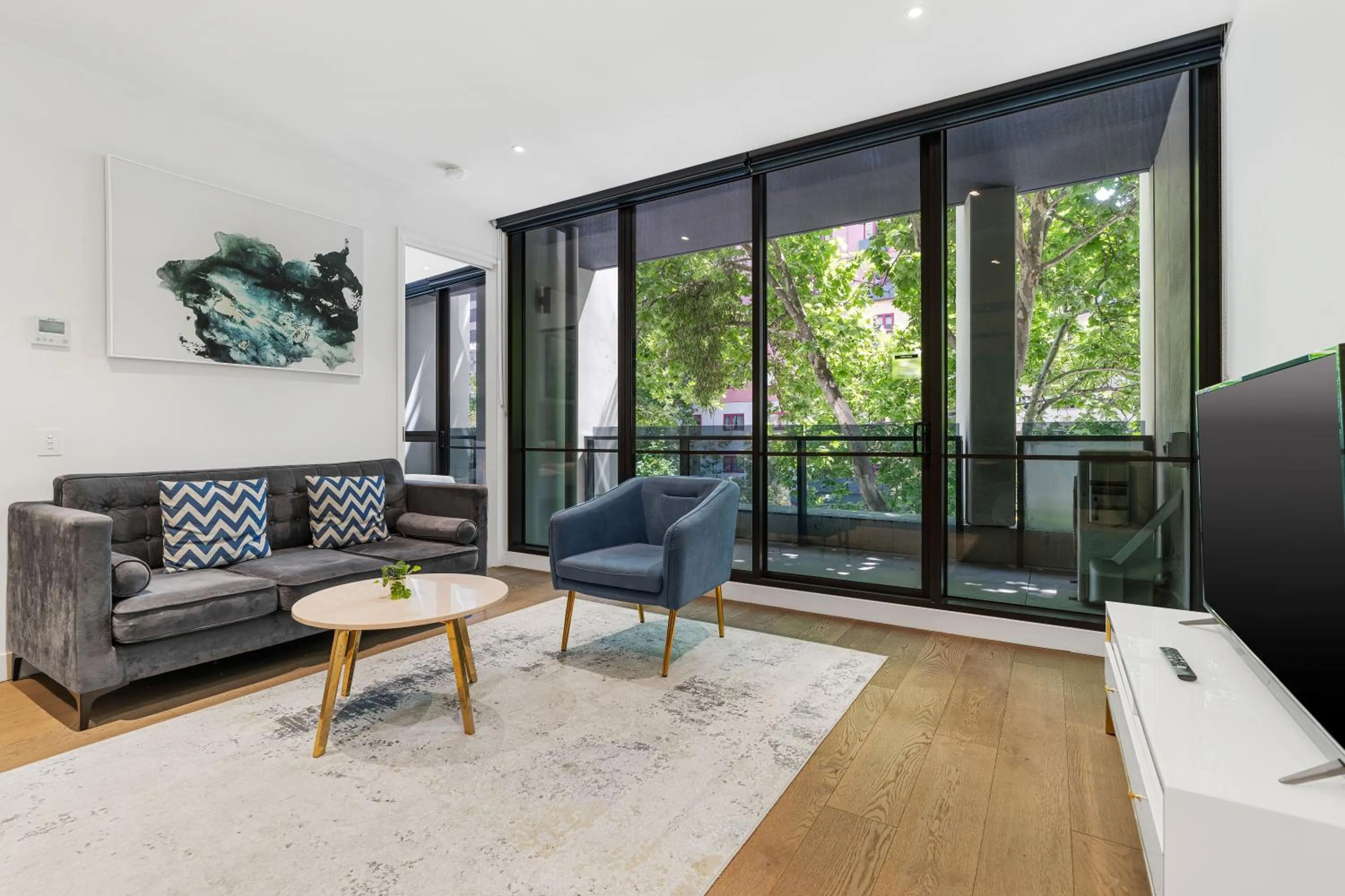 Living room in The Eminence Apartments by CLLIX