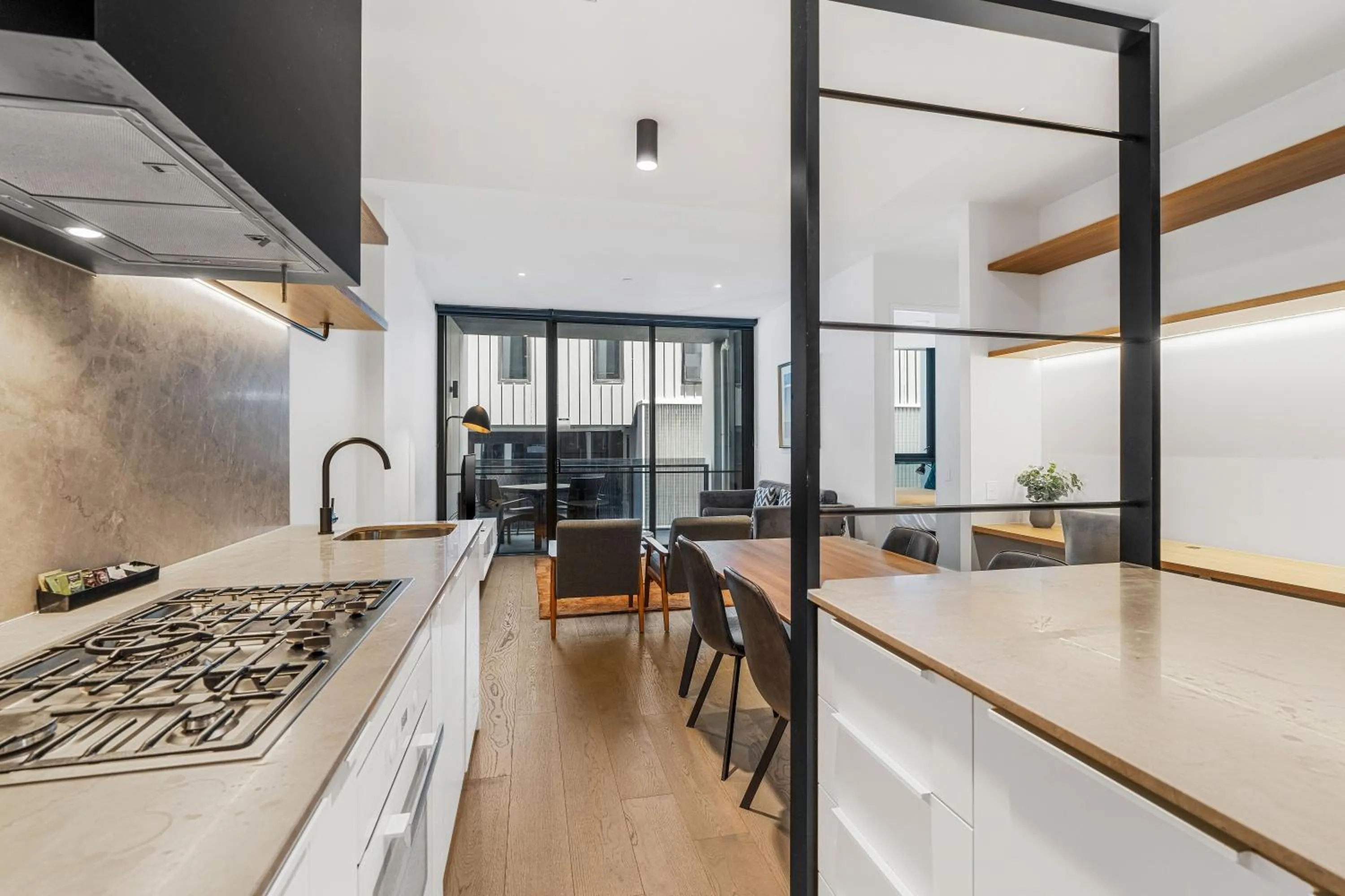 Kitchen or kitchenette in The Eminence Apartments by CLLIX