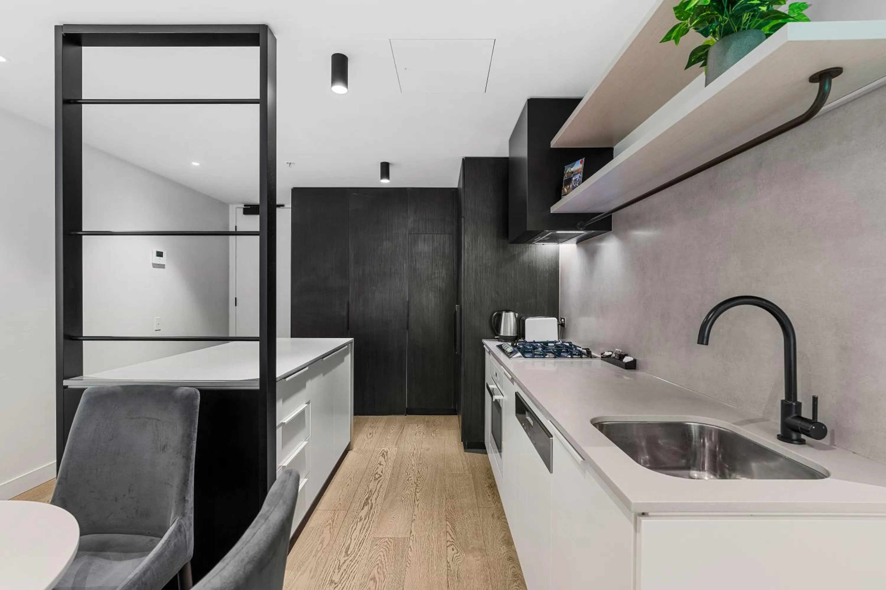 Kitchen or kitchenette in The Eminence Apartments by CLLIX