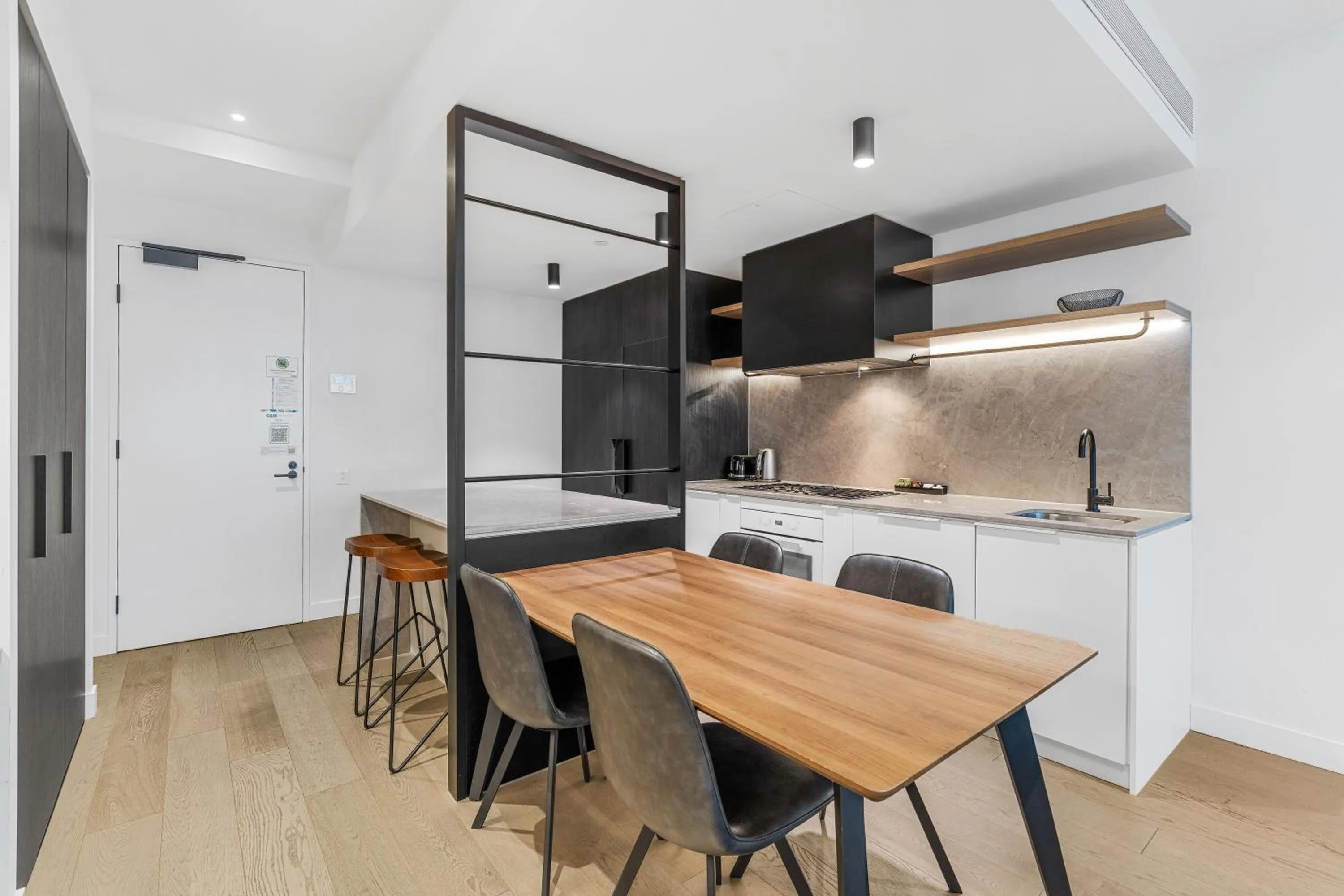 Kitchen or kitchenette in The Eminence Apartments by CLLIX