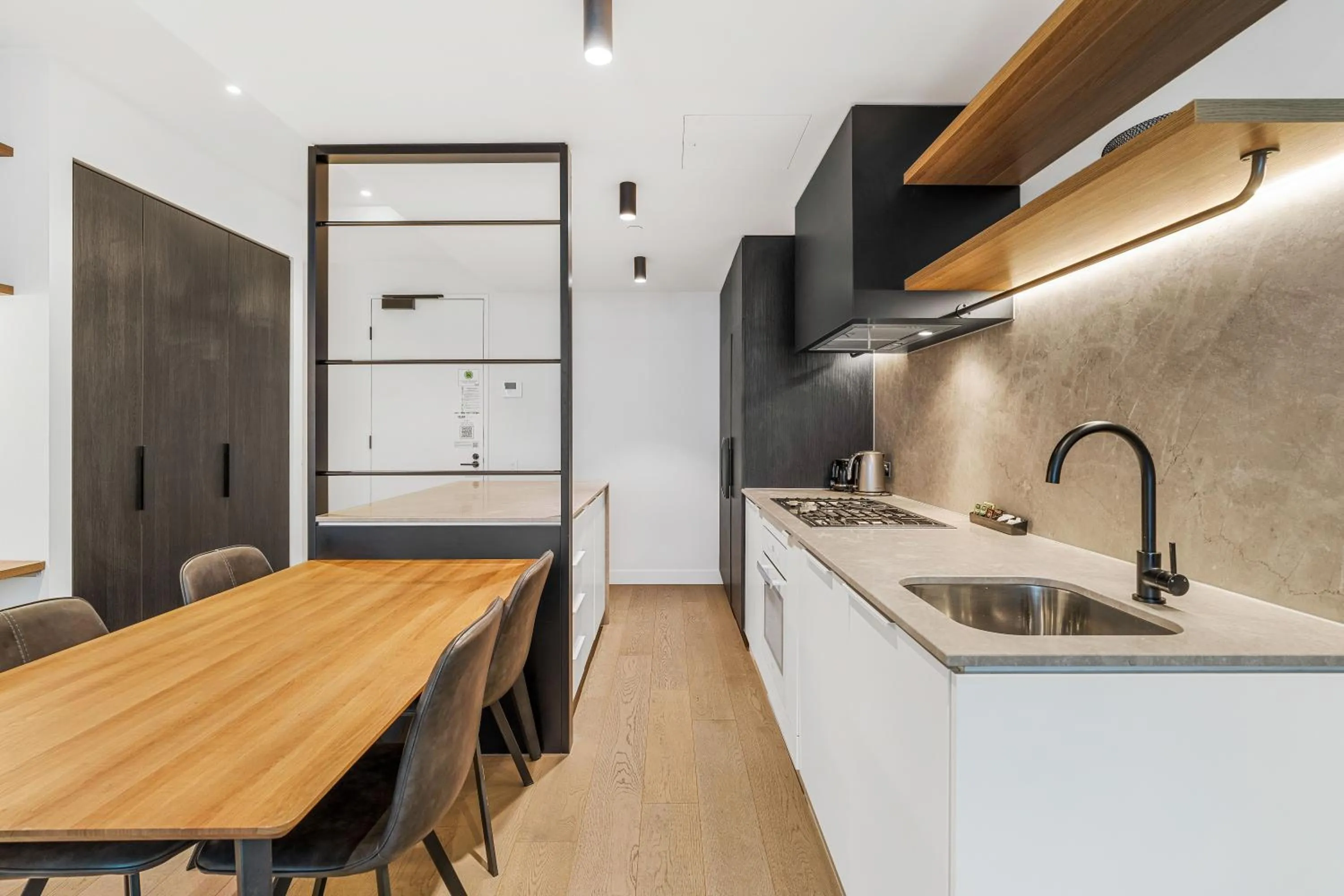 Kitchen or kitchenette in The Eminence Apartments by CLLIX