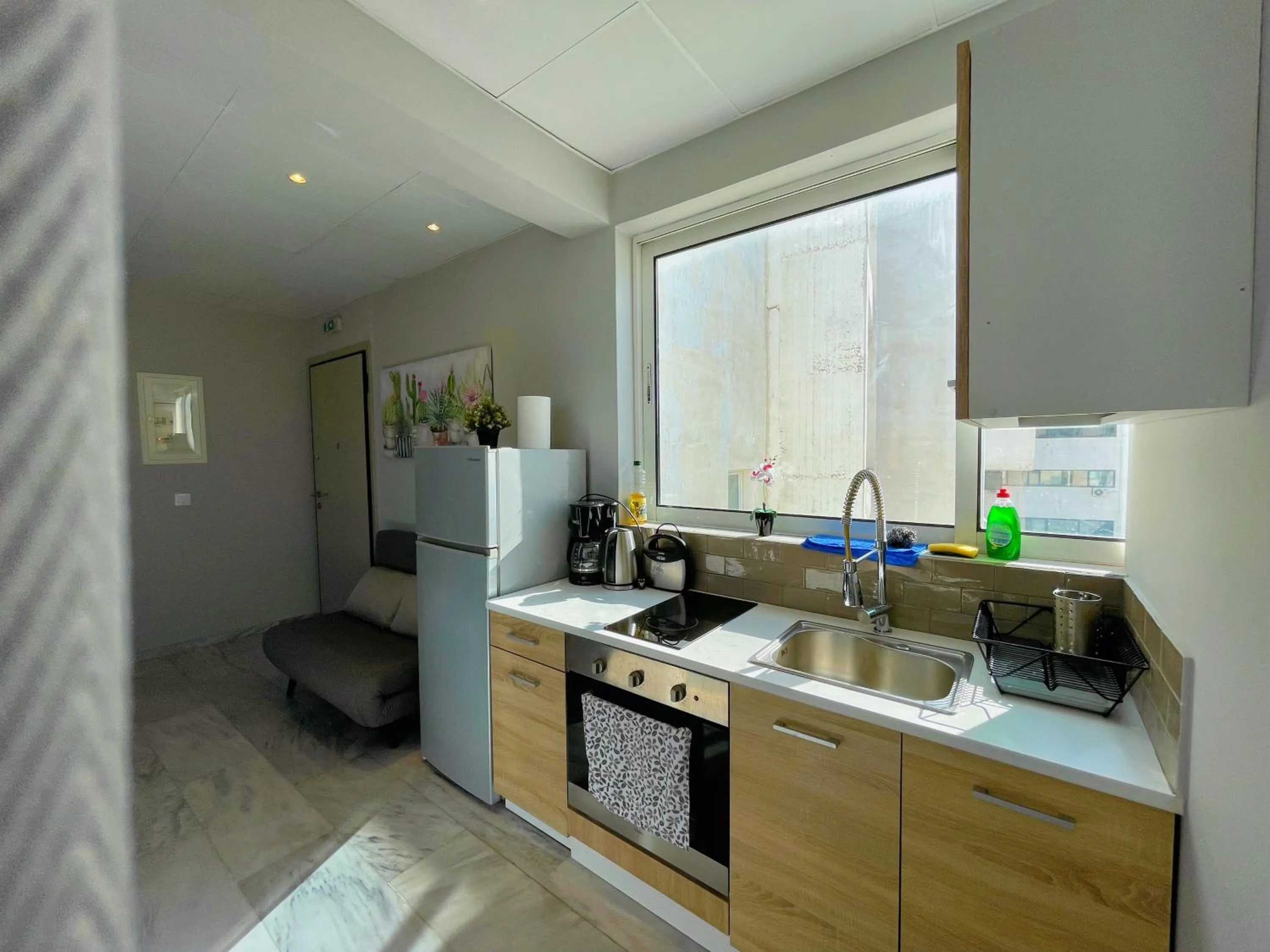 Kitchen or kitchenette in WSD Baia Acropolis Hotel Apartment