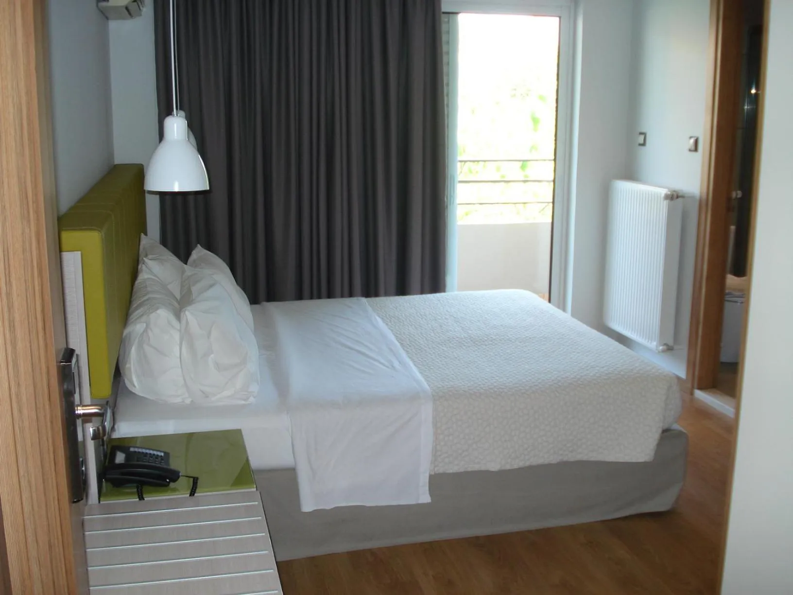 Bed in Elements Rooms & Apartments