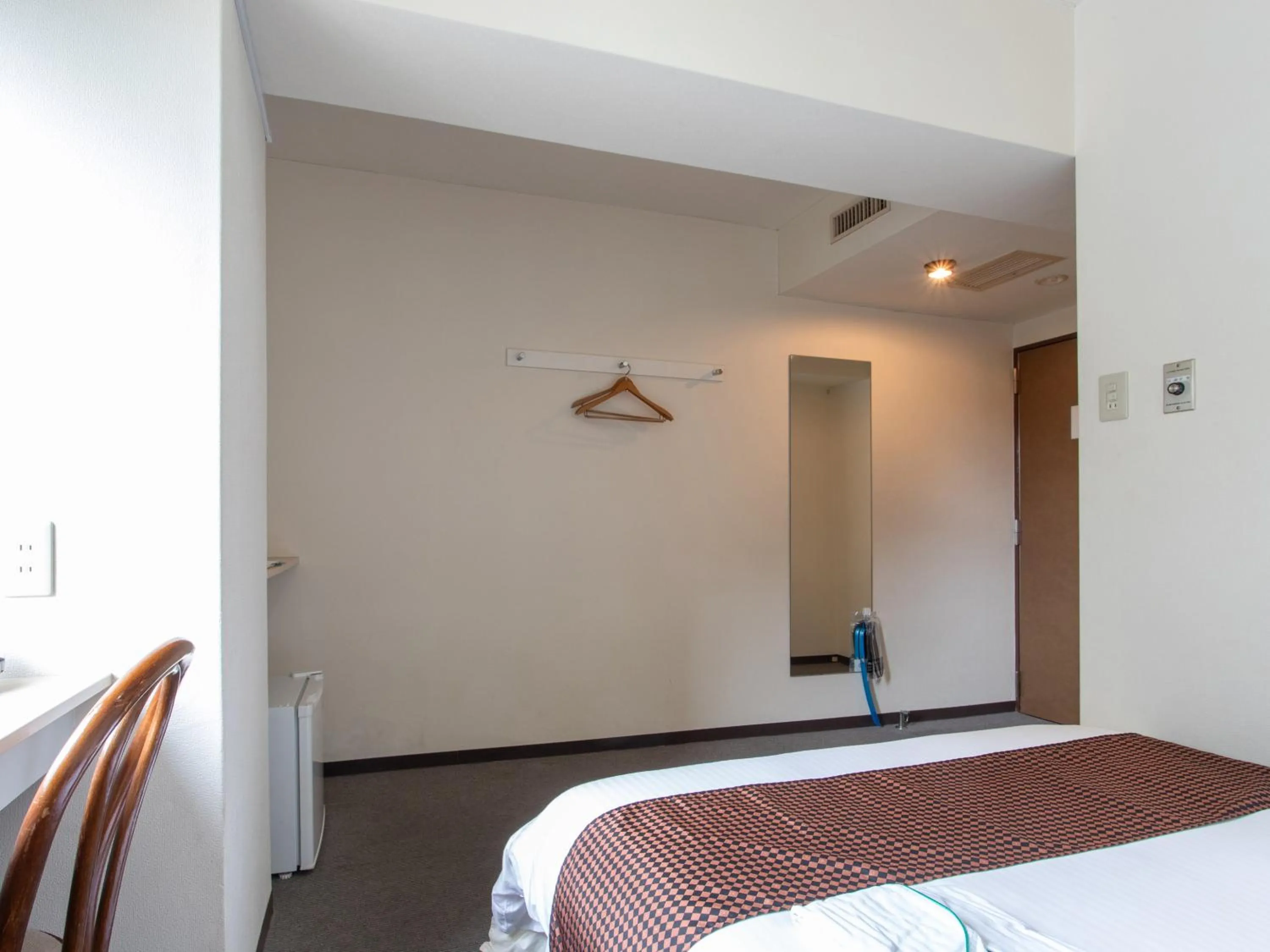 Bed in Tabist Sasebo Palace Hotel