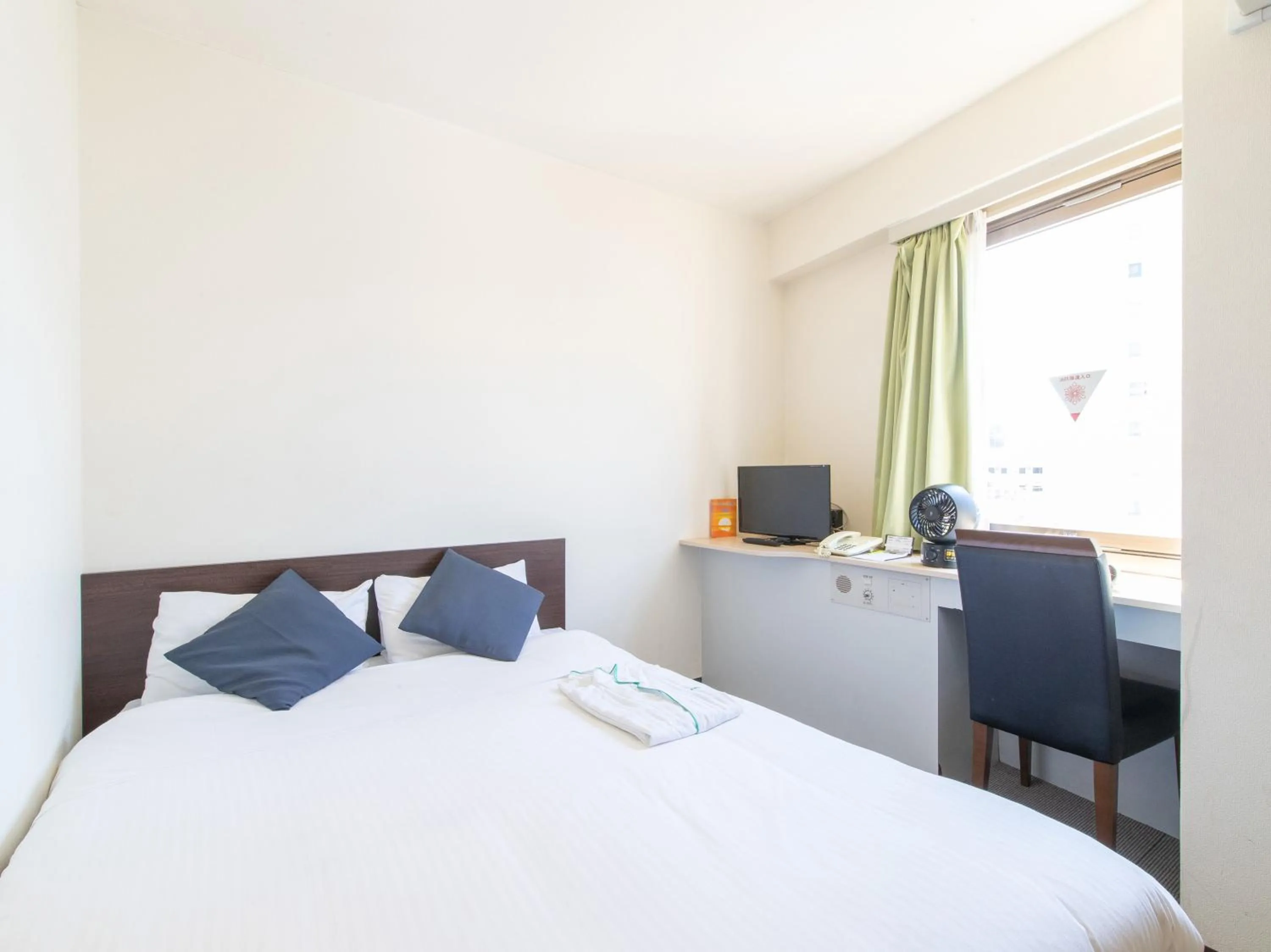 Bed in Tabist Sasebo Palace Hotel