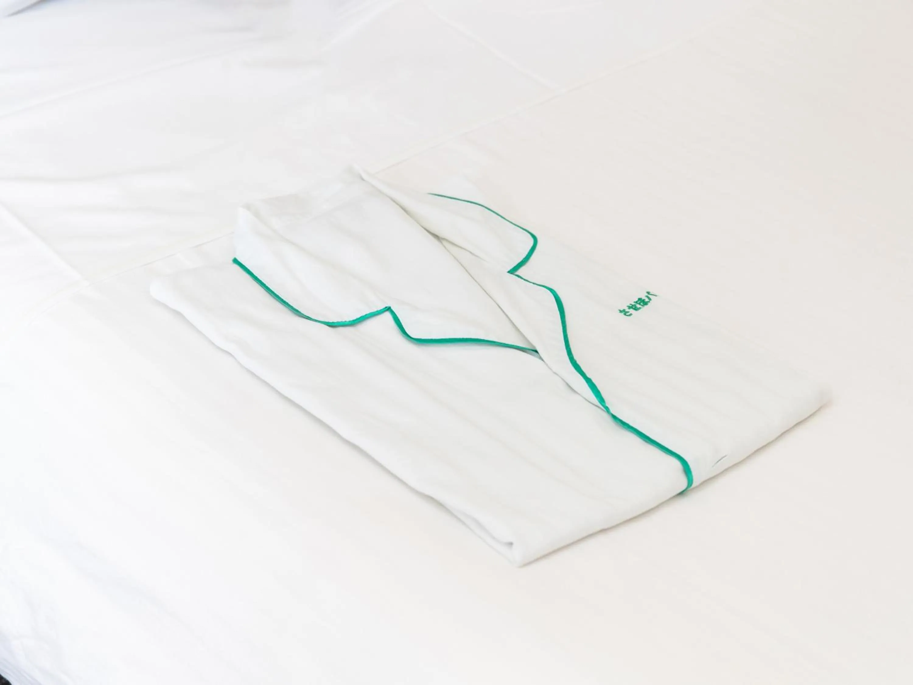 Bed in Tabist Sasebo Palace Hotel