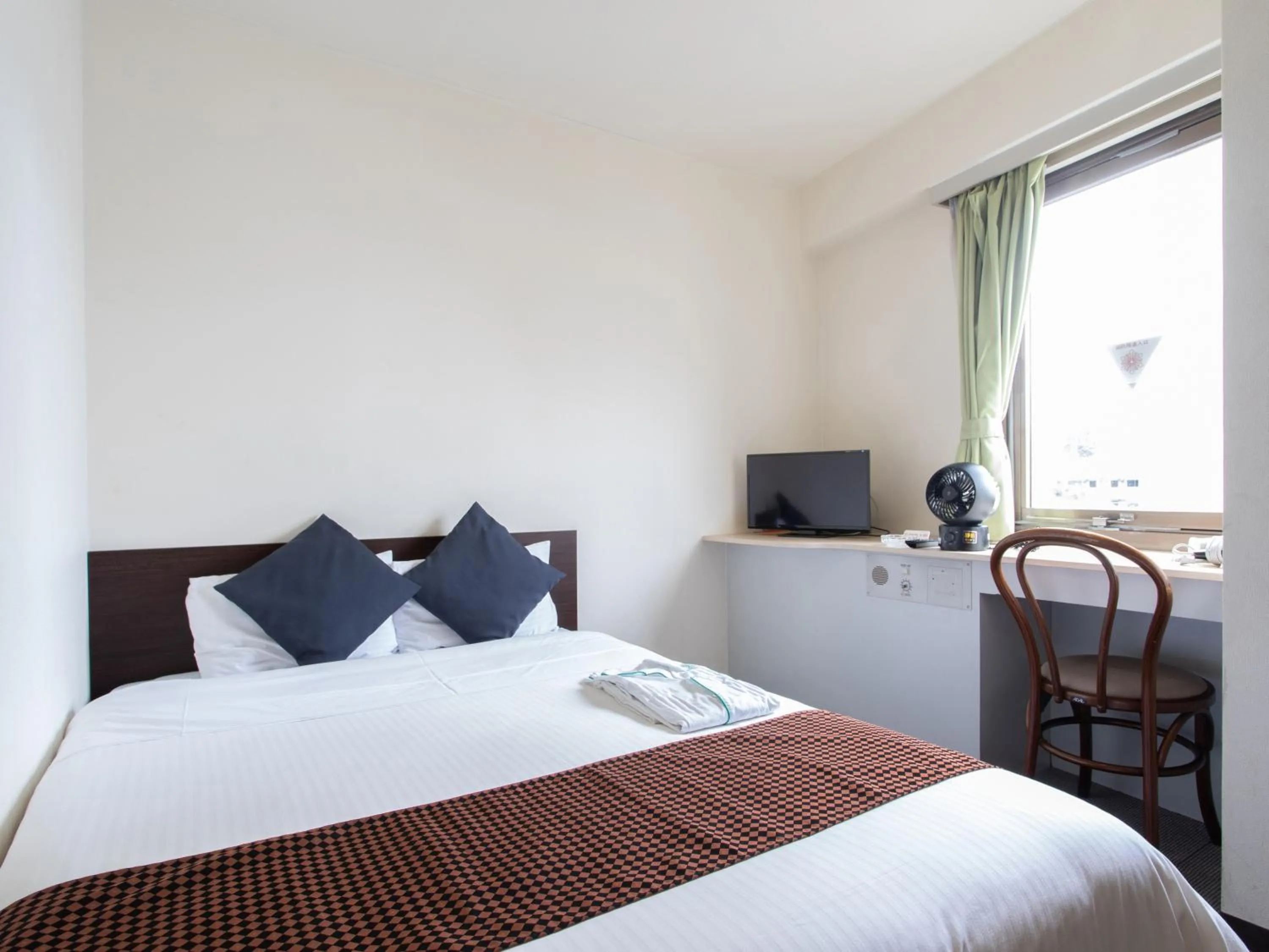 Bed in Tabist Sasebo Palace Hotel