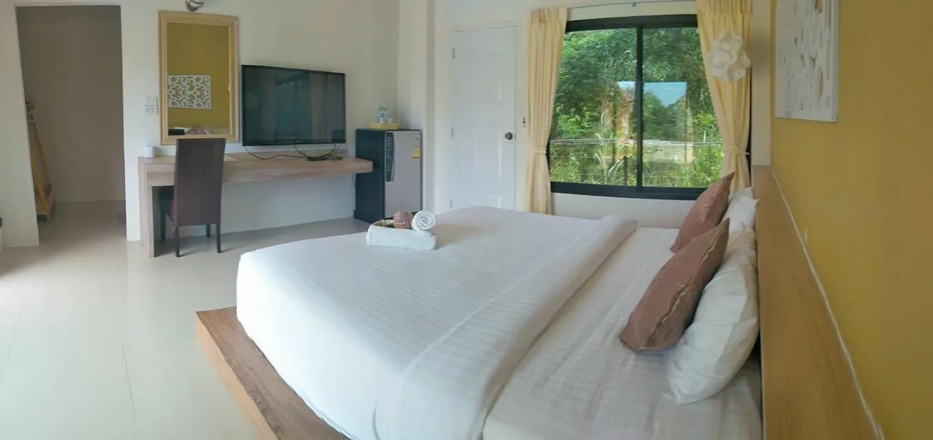 Bed in Suwi Coco Ville Resort