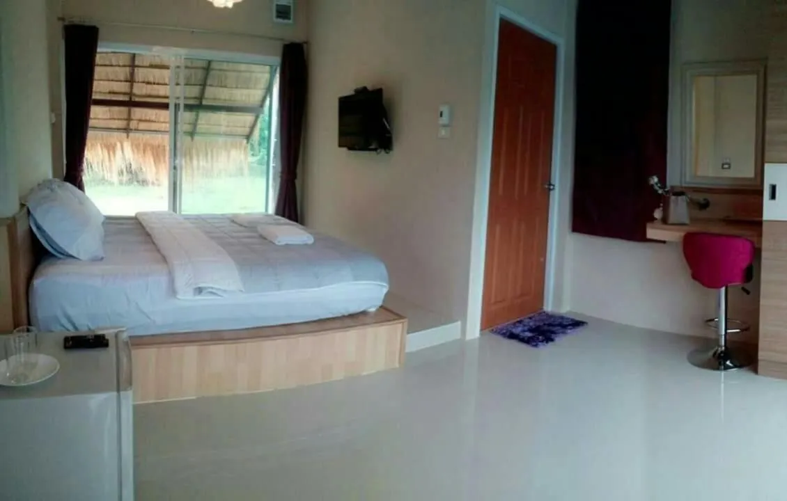 Bed in Suwi Coco Ville Resort