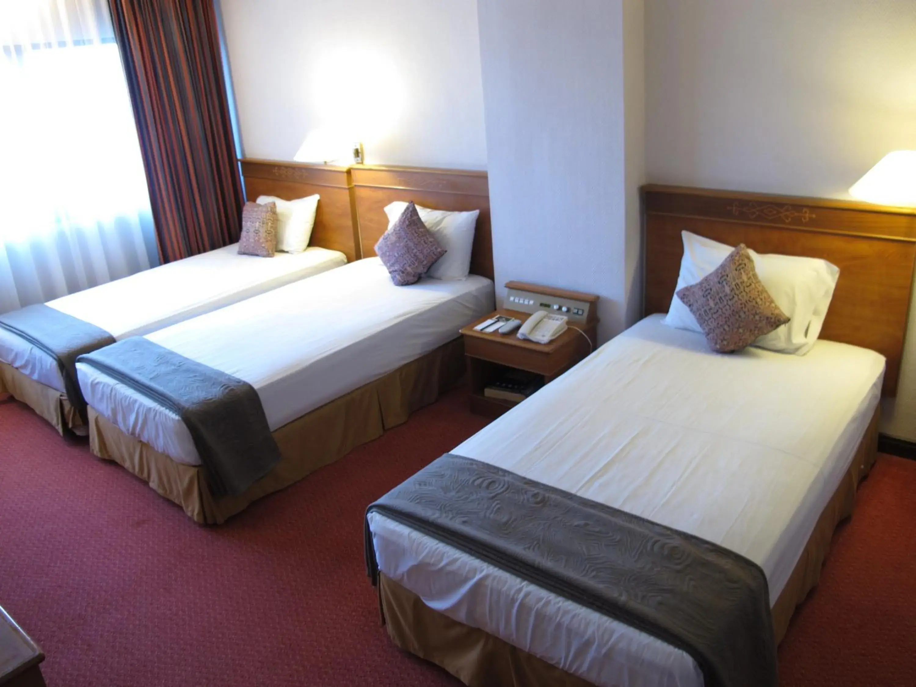 Deluxe Triple Room in Hotel Grand Continental Kuching Deluxe Triple Room in Hotel Grand Continental Kuching