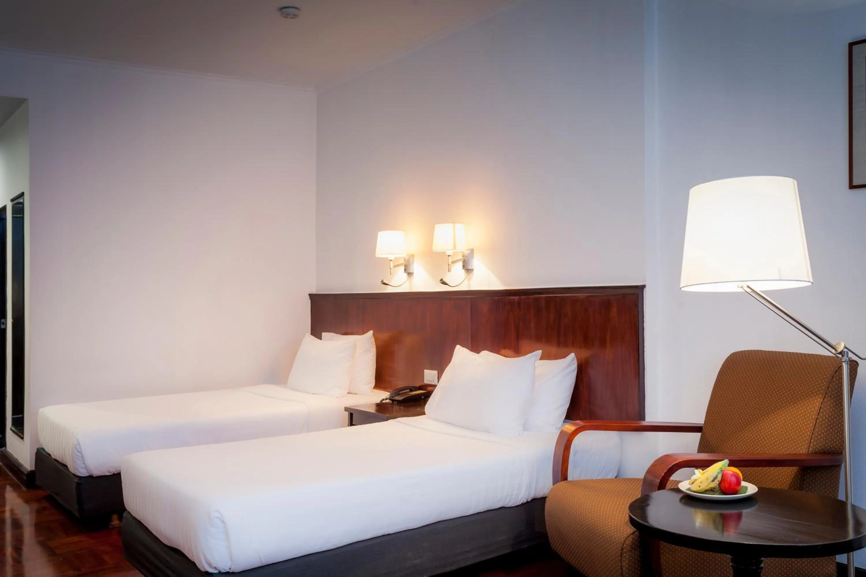 Bed in Le Charme Vientiane Hotel