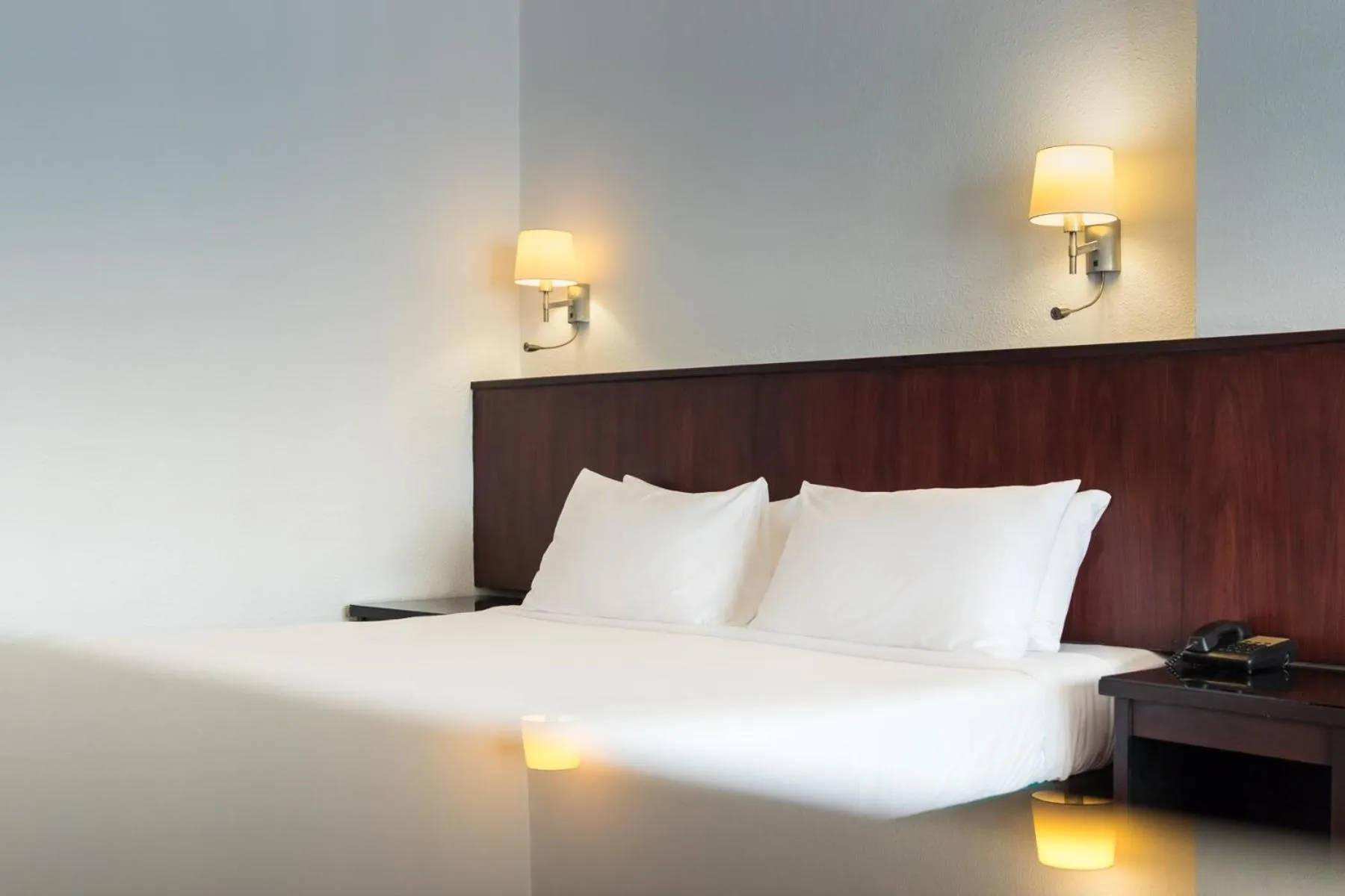 Bed in Le Charme Vientiane Hotel