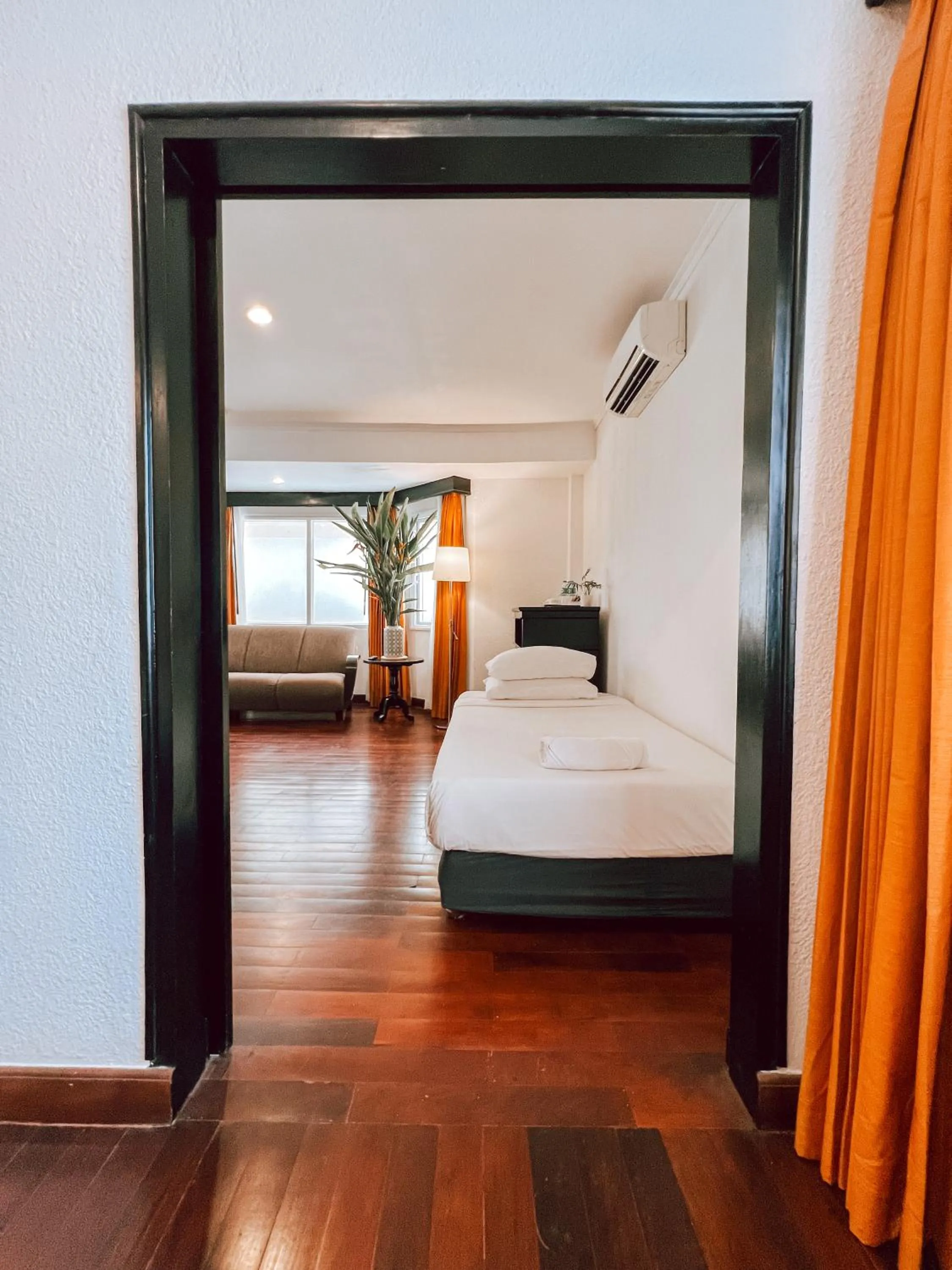 Bed in Le Charme Vientiane Hotel