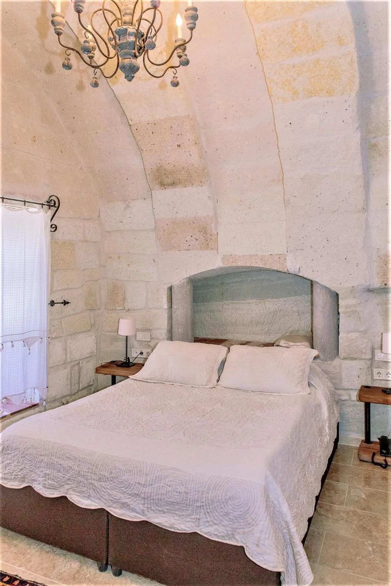 Living room, Bed in Panoramic Cave Hotel