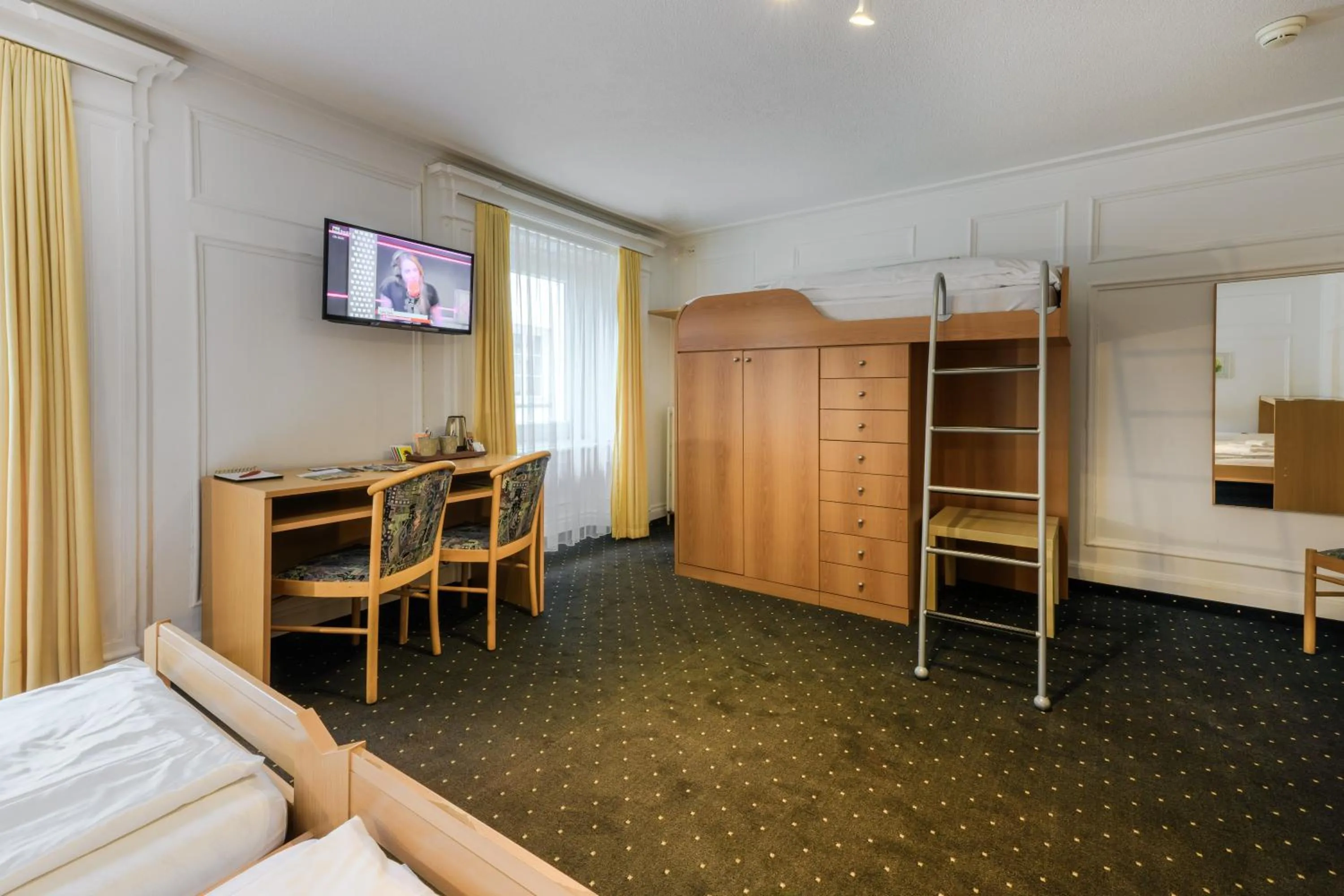 Bed in Poschiavo Suisse Hotel