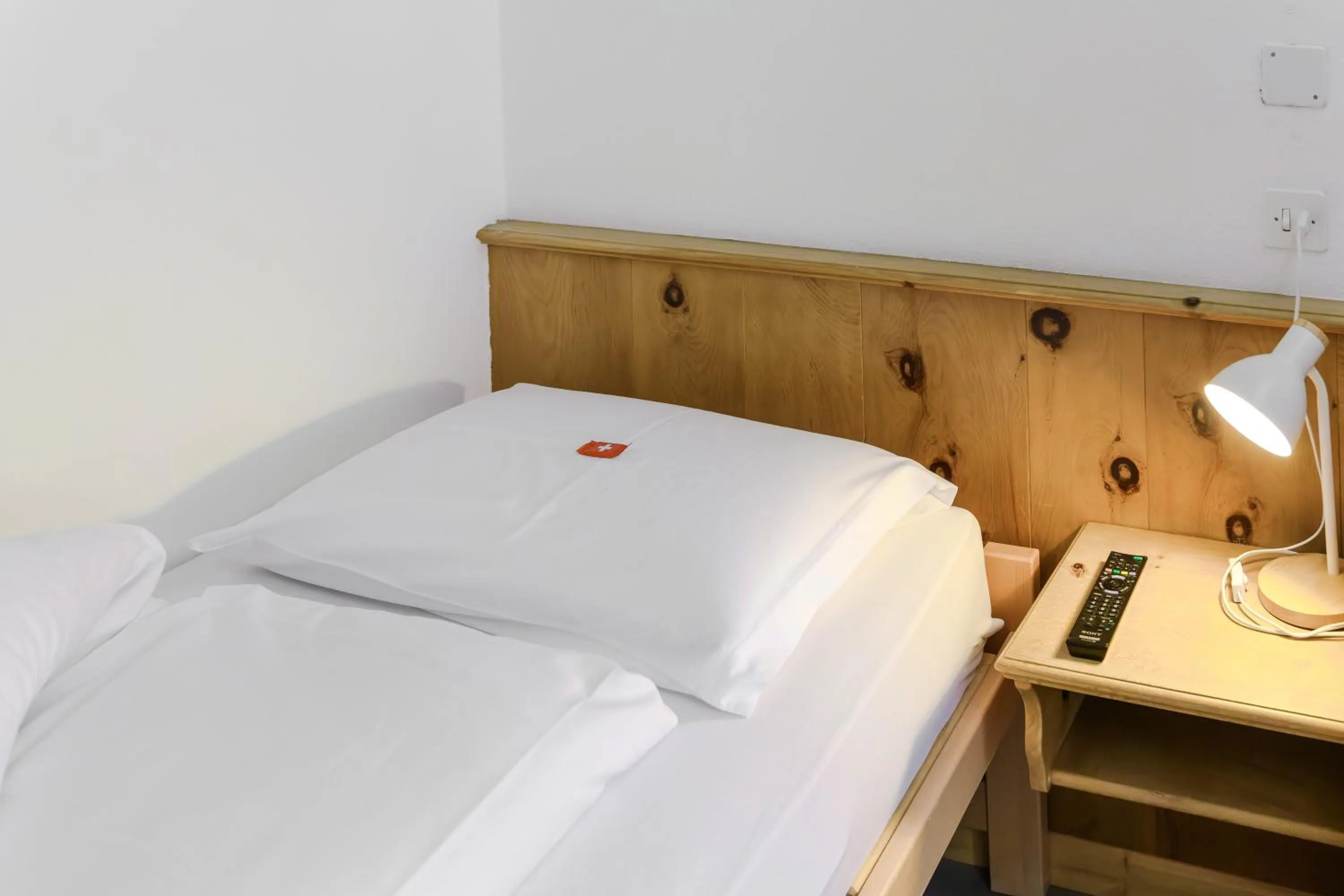 Bed in Poschiavo Suisse Hotel