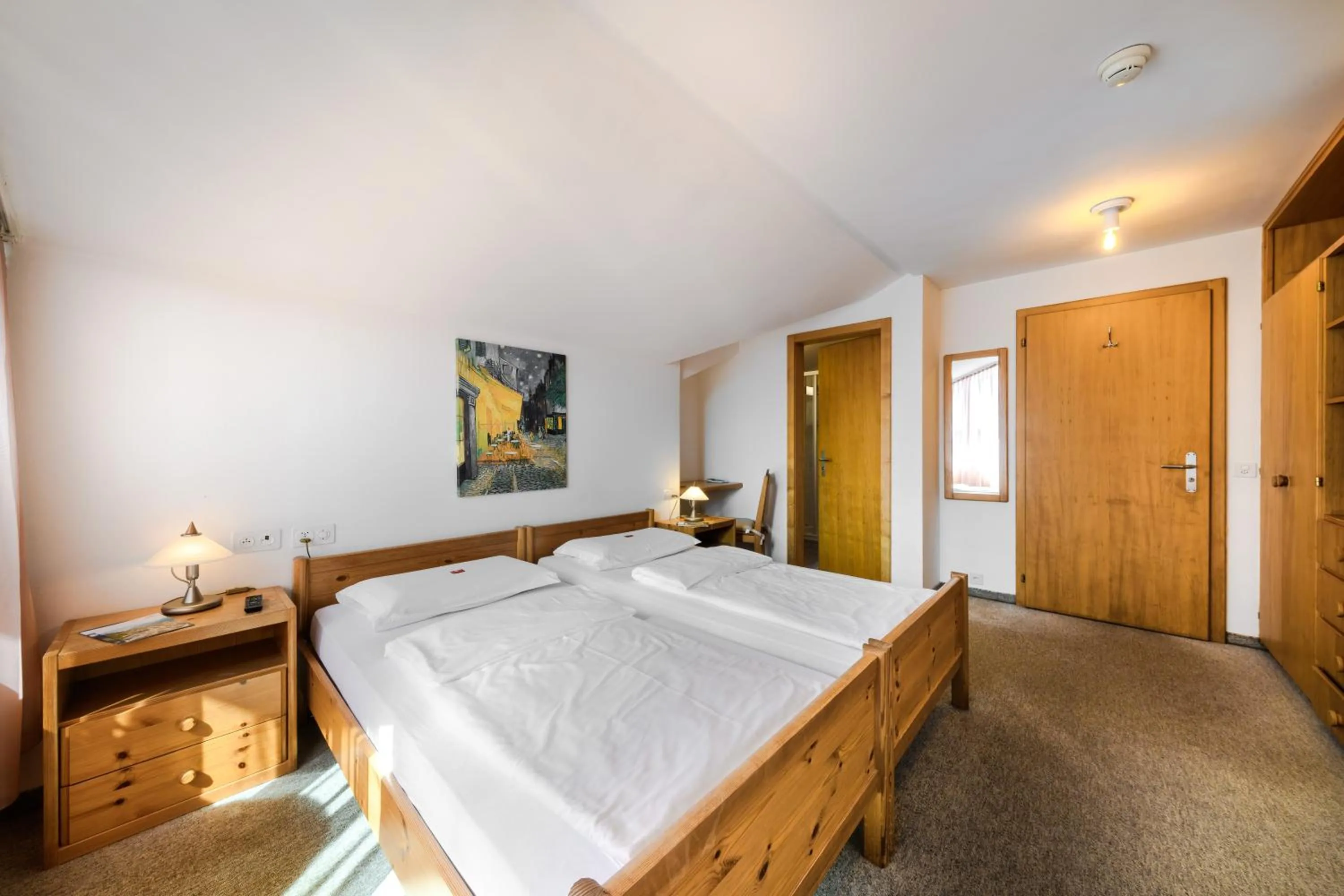 Bed in Poschiavo Suisse Hotel