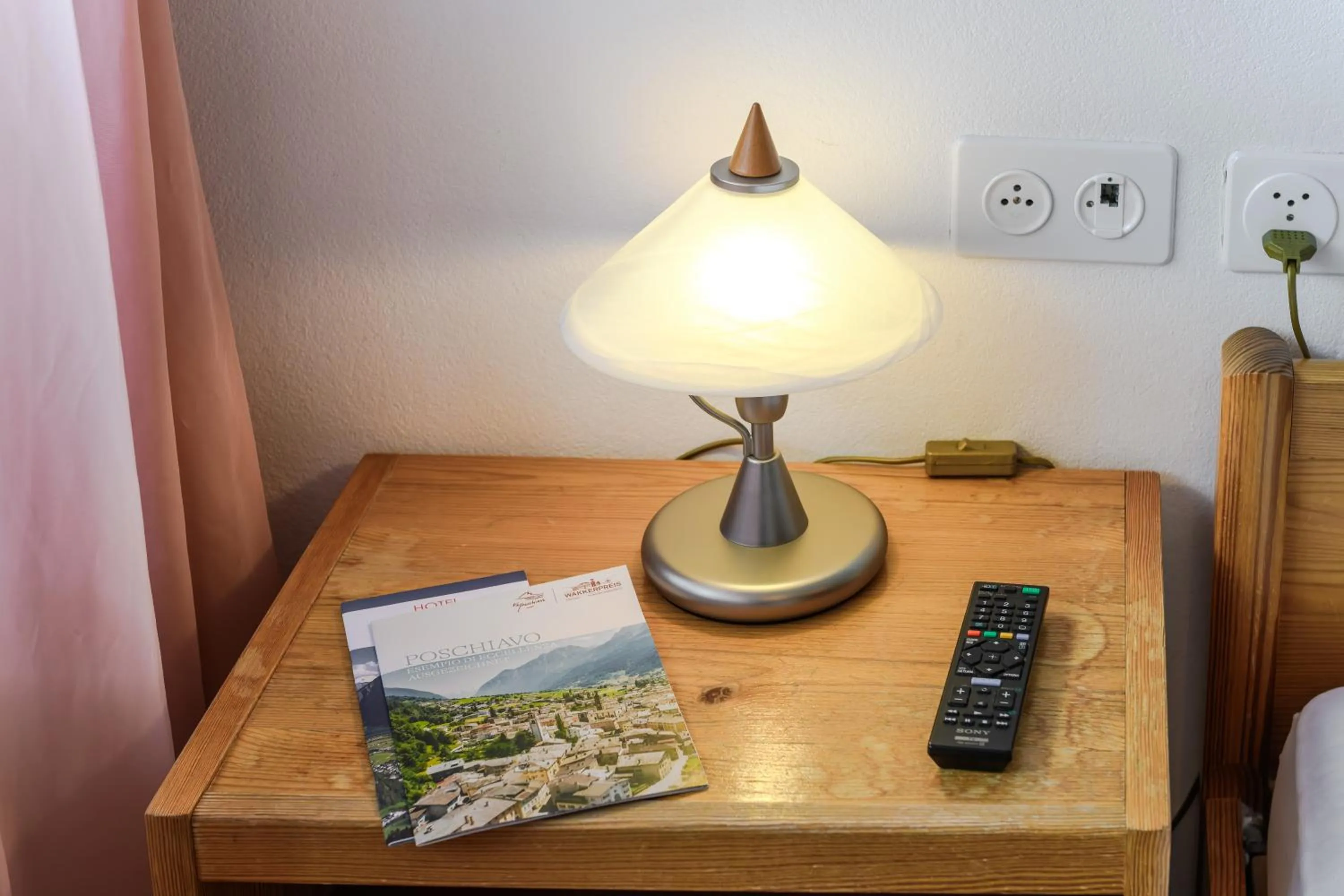 Bedroom in Poschiavo Suisse Hotel