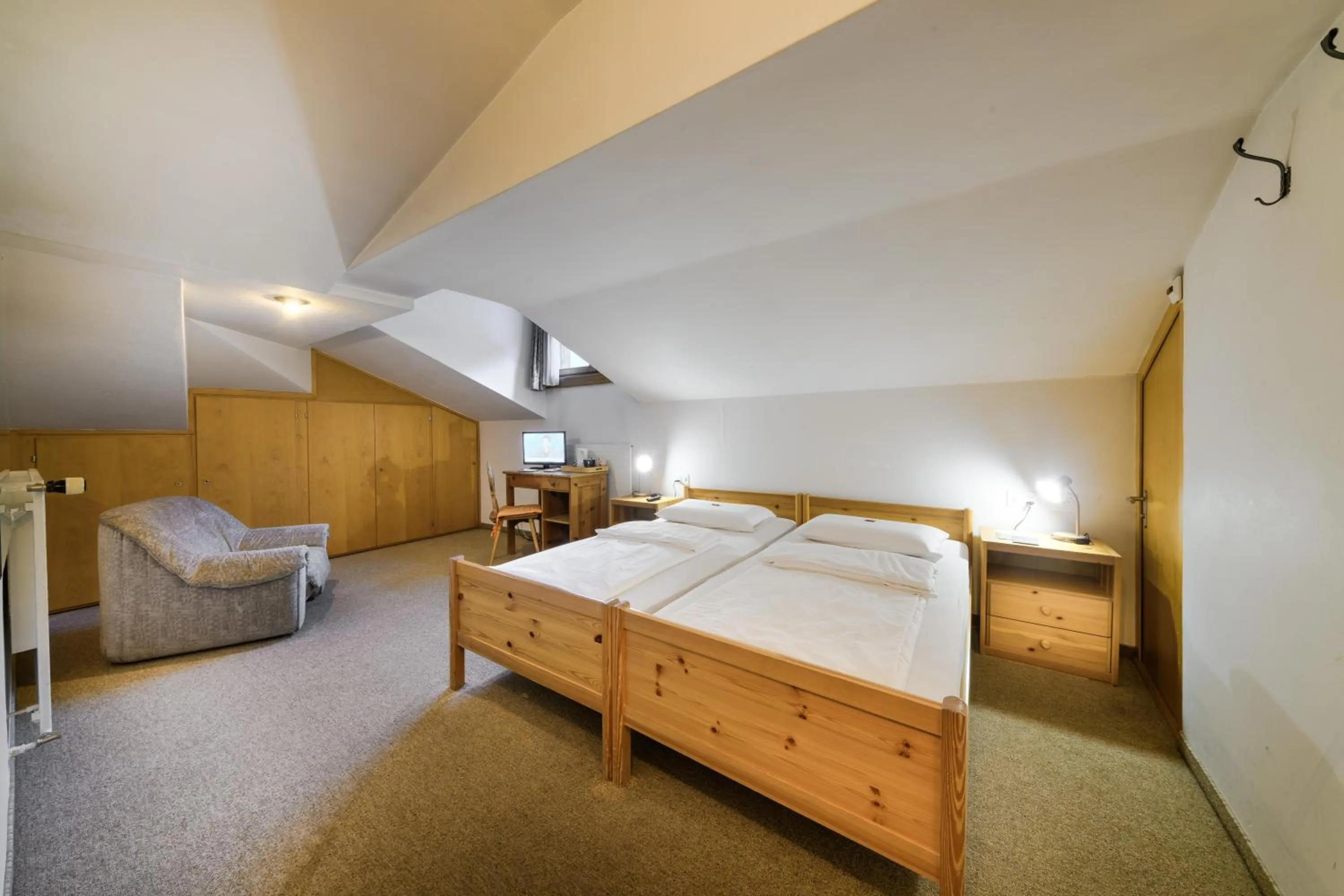 Bed in Poschiavo Suisse Hotel