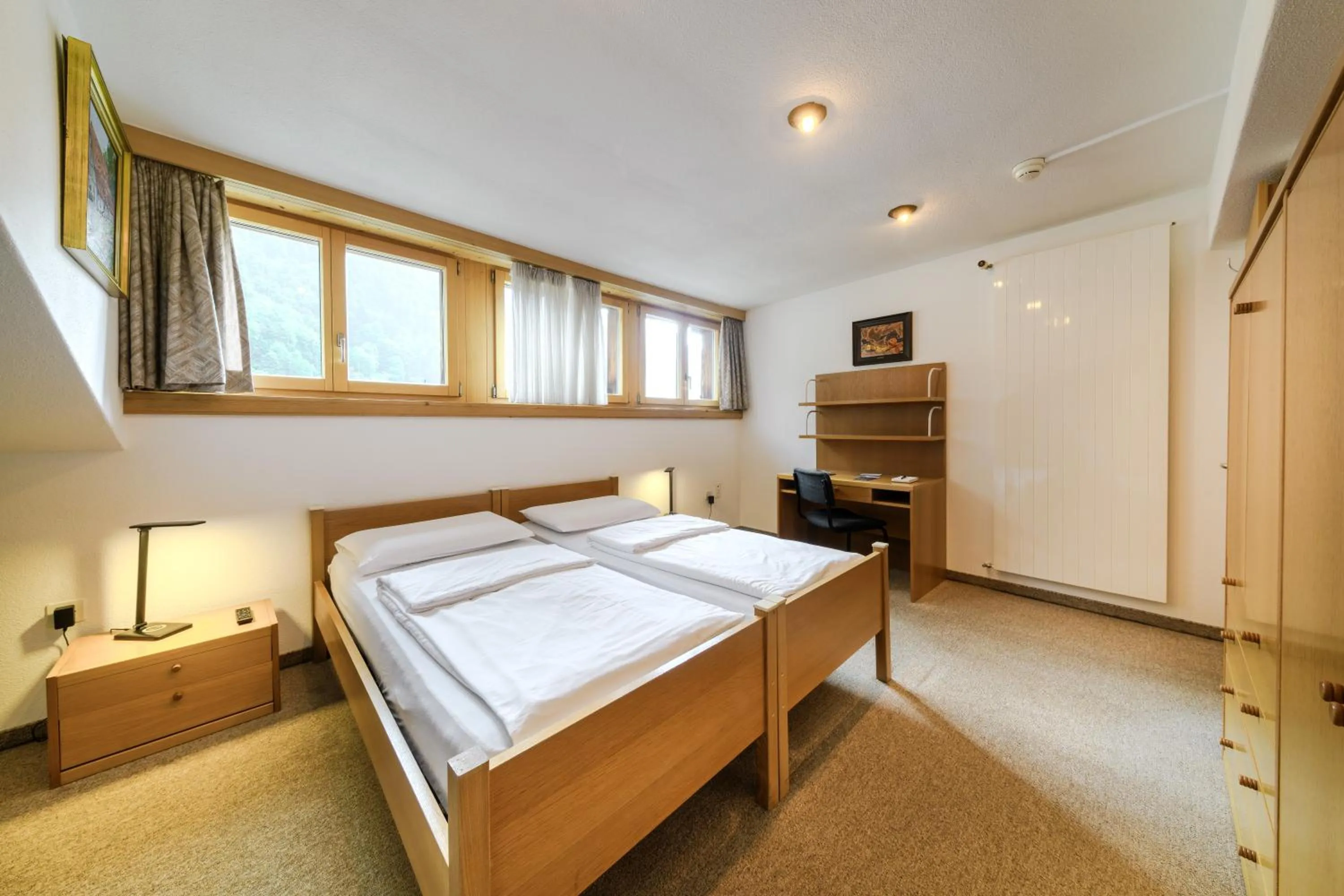 Bed in Poschiavo Suisse Hotel