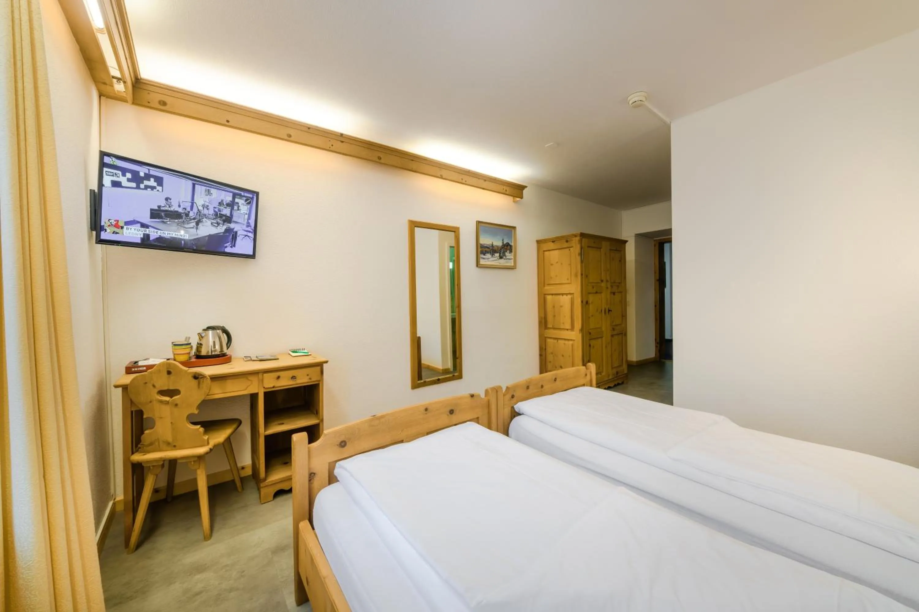 Bed in Poschiavo Suisse Hotel