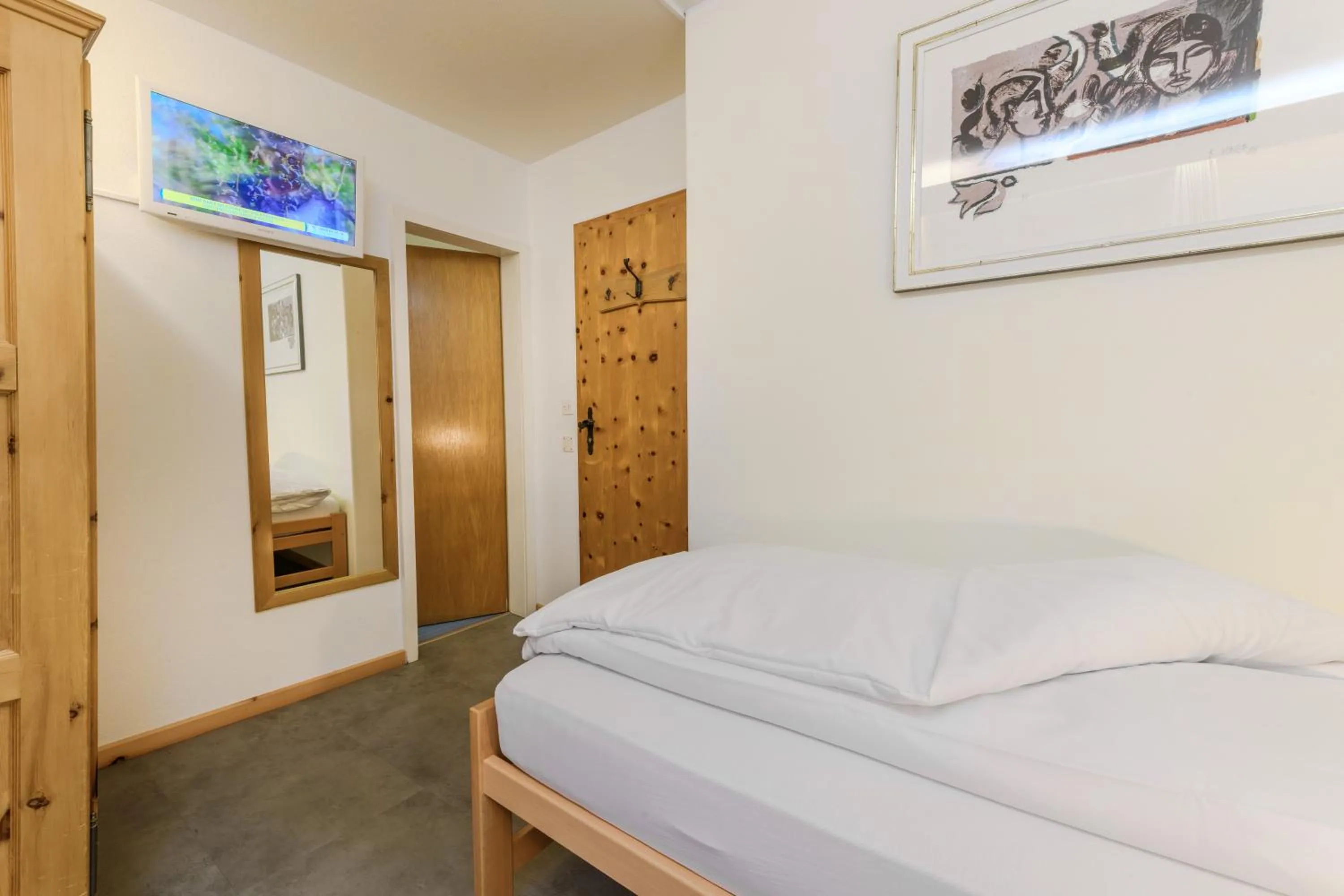 Bed in Poschiavo Suisse Hotel