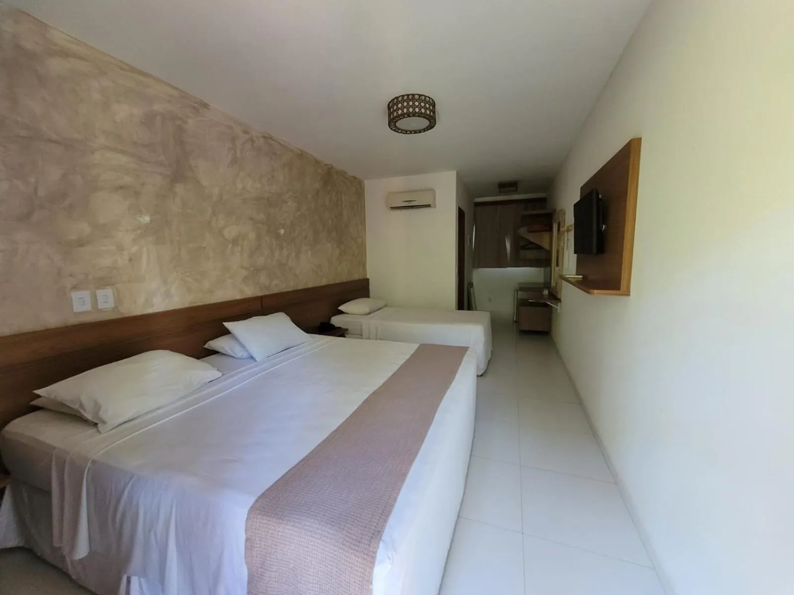 Bed in Aquarela Praia Hotel