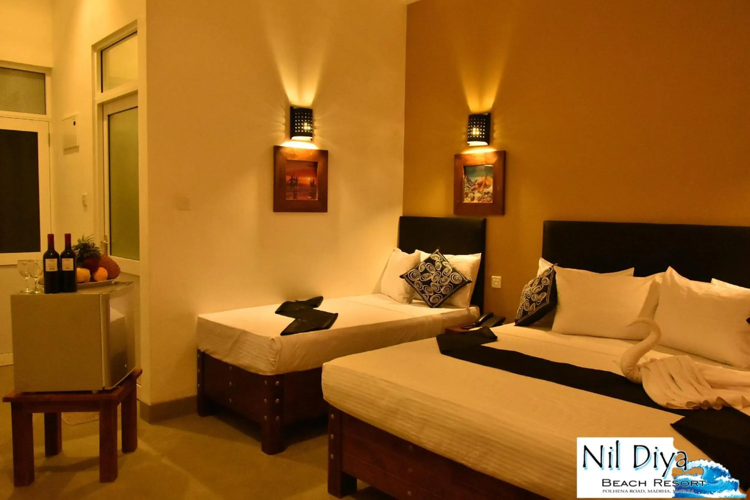 Photo of the whole room, Bed in Nil Diya Beach Resort