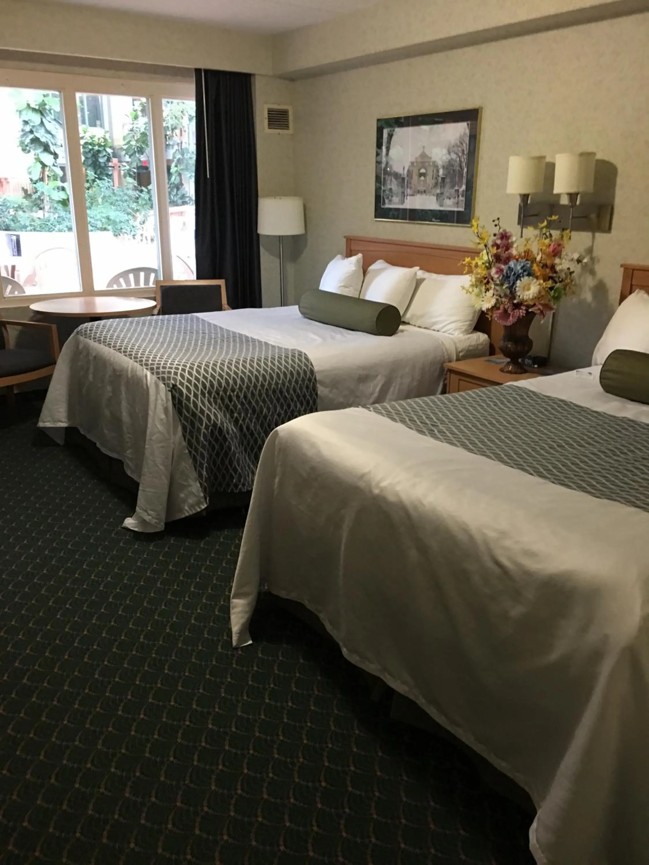 Swimming pool, Bed in Travelodge by Wyndham Winnipeg East