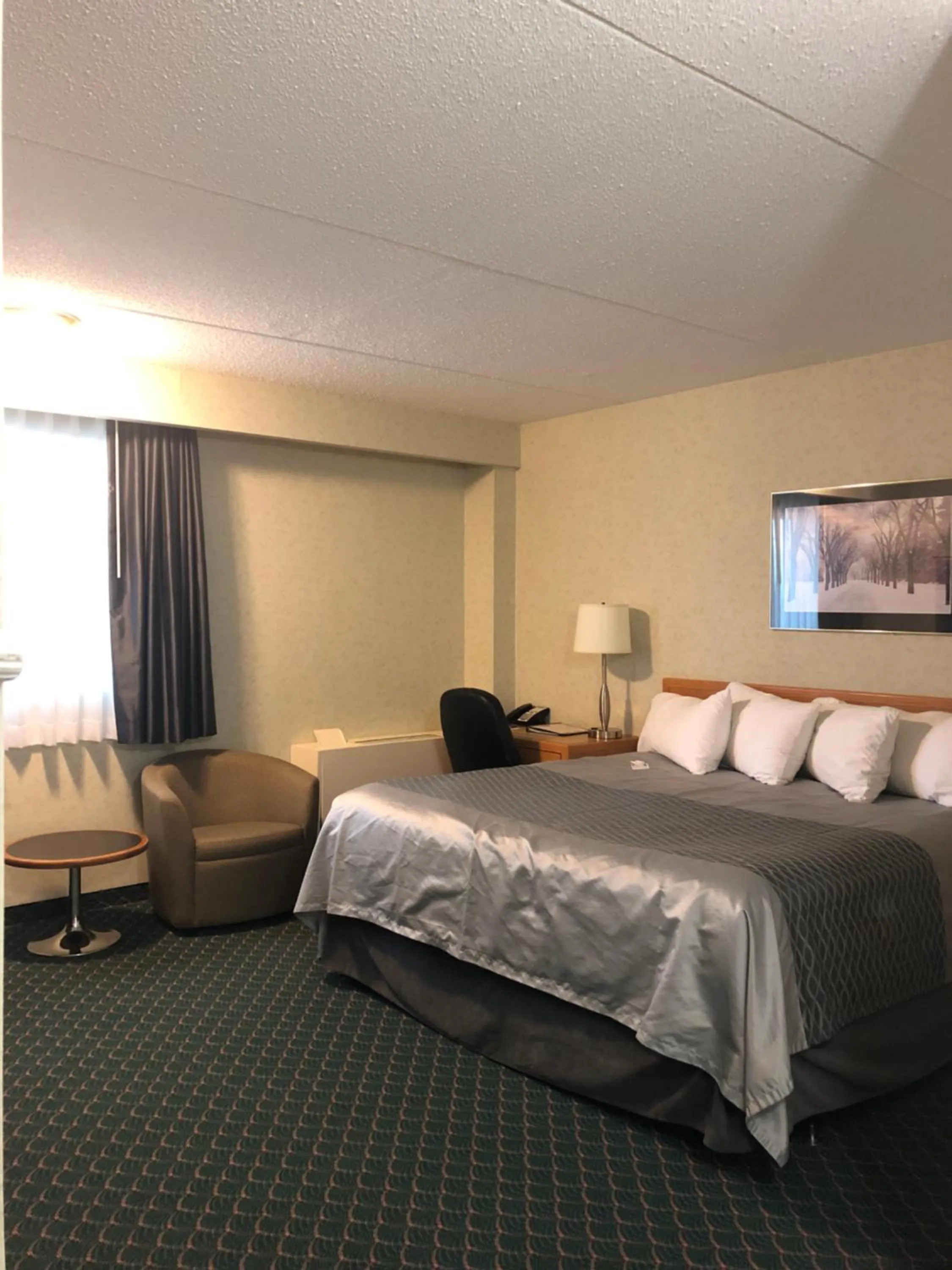 Swimming pool, Bed in Travelodge by Wyndham Winnipeg East