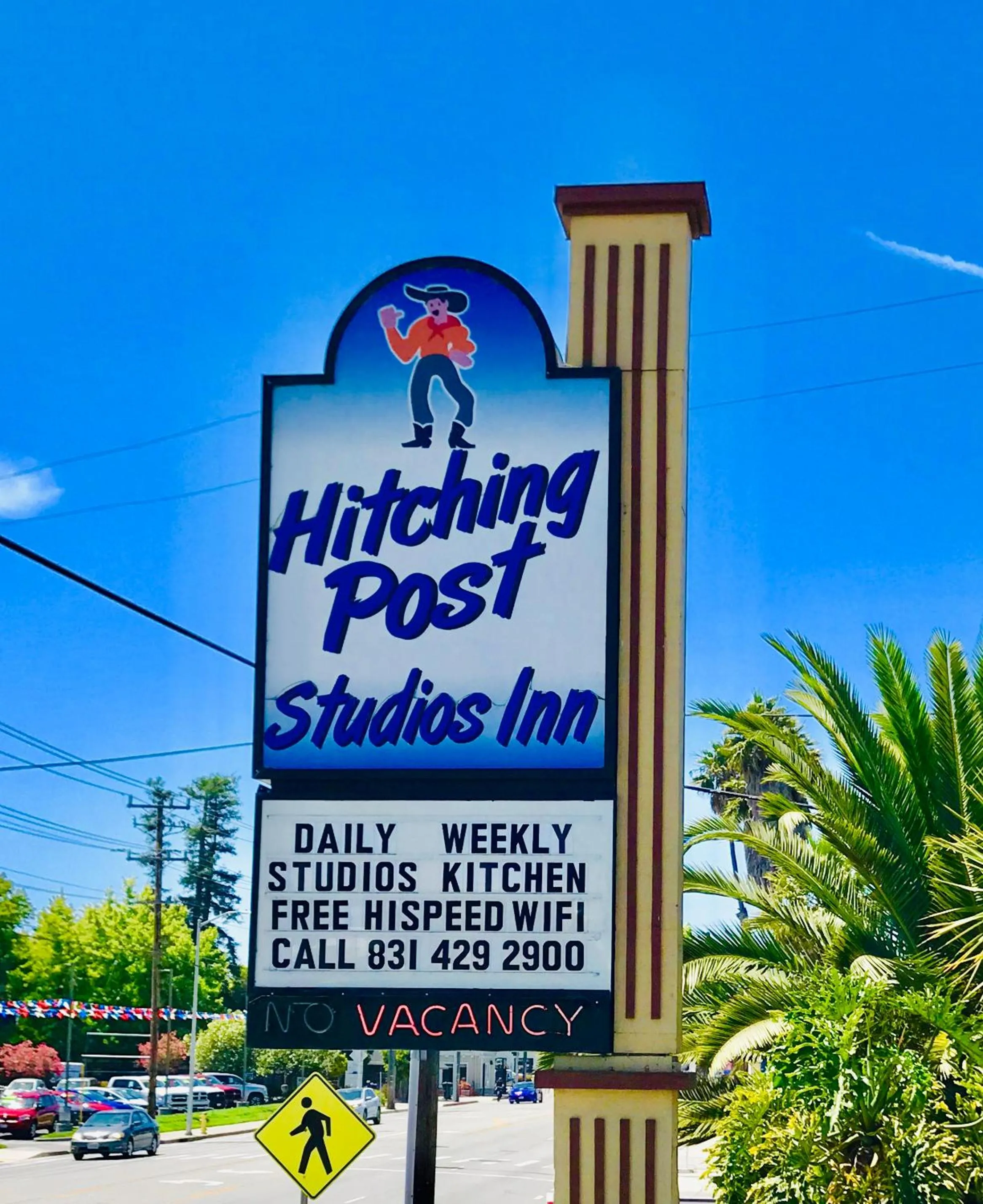 Property logo or sign in Hitching Post Studios Inn