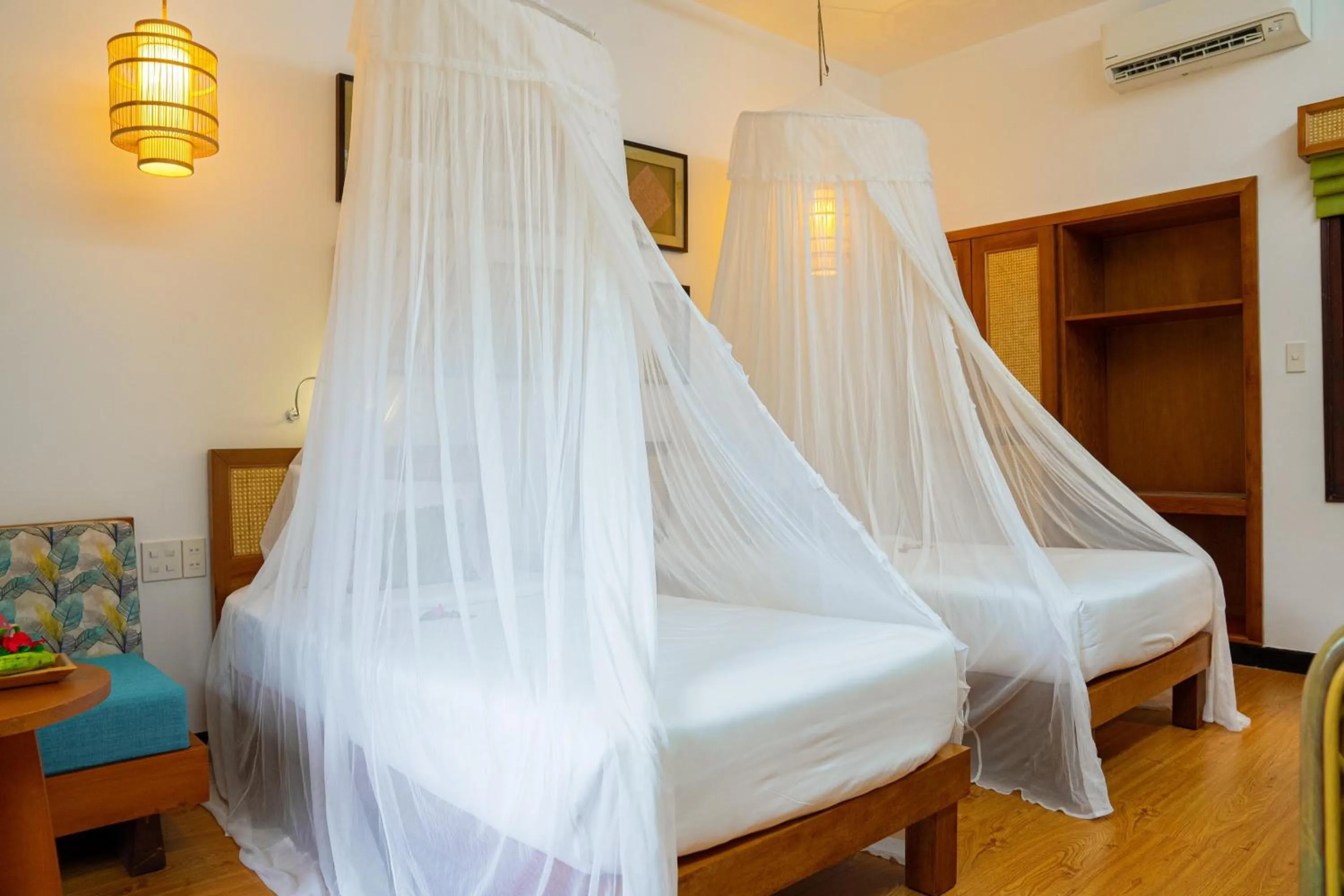 Bedroom, Bed in Bamboo Village Beach Resort & Spa