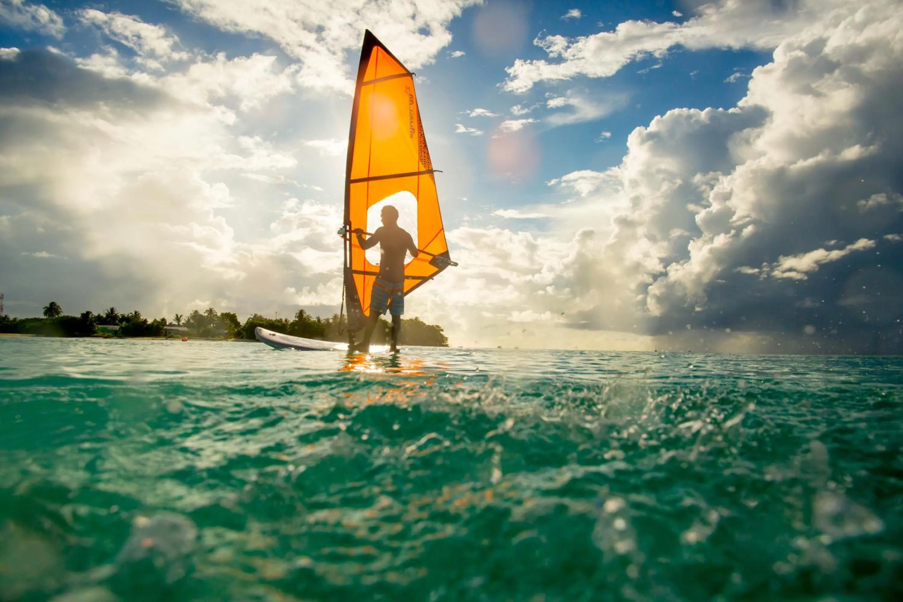 Windsurfing in Holiday Inn Resort Kandooma Maldives - Kids Stay & Eat Free and Free Roundtrip Speed Boat for a minimum 4 nights stay