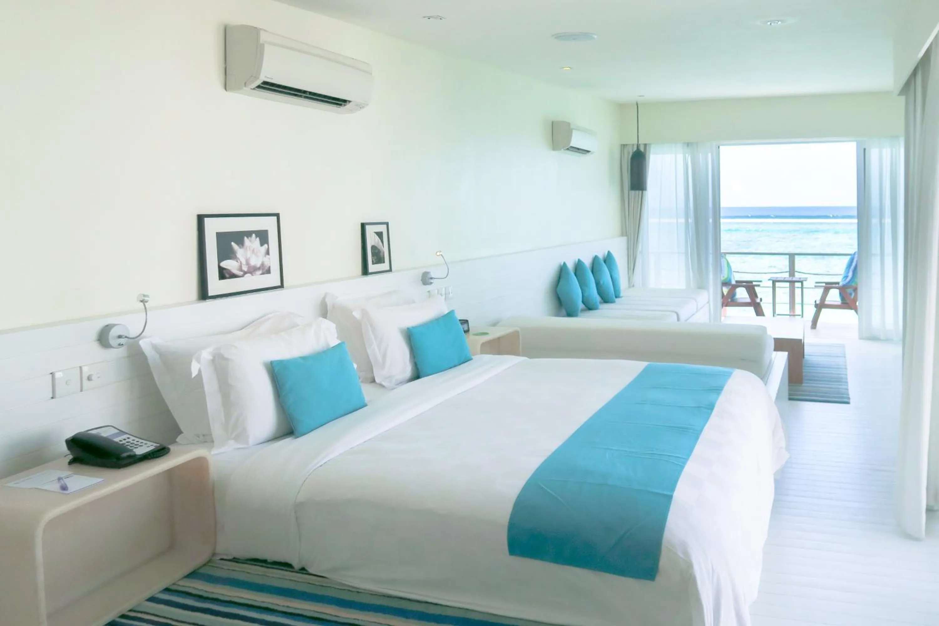 Photo of the whole room, Bed in Holiday Inn Resort Kandooma Maldives - Kids Stay & Eat Free and Free Roundtrip Speed Boat for a minimum 4 nights stay