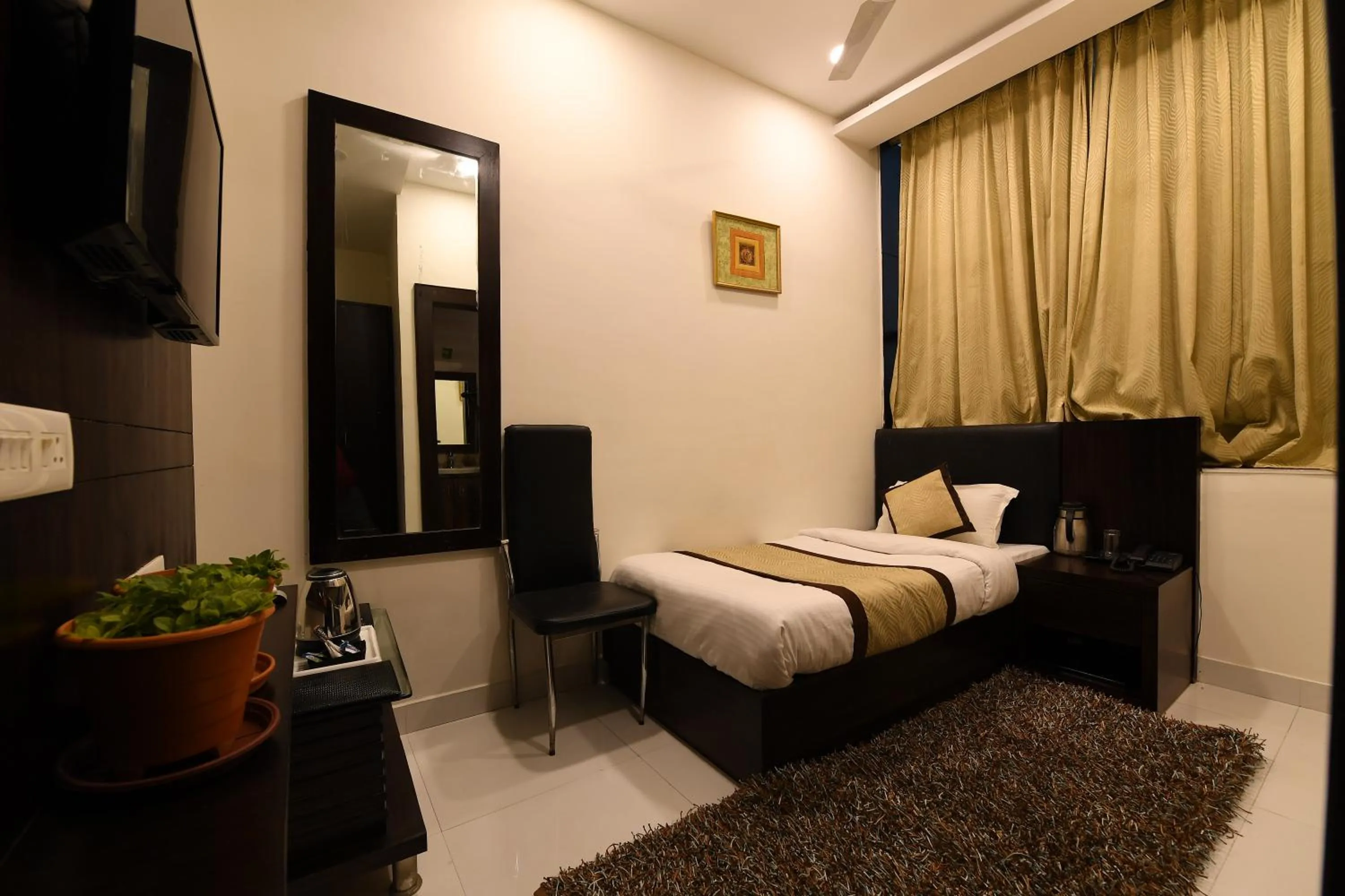 Photo of the whole room, Bed in Madhav Muskan Residency