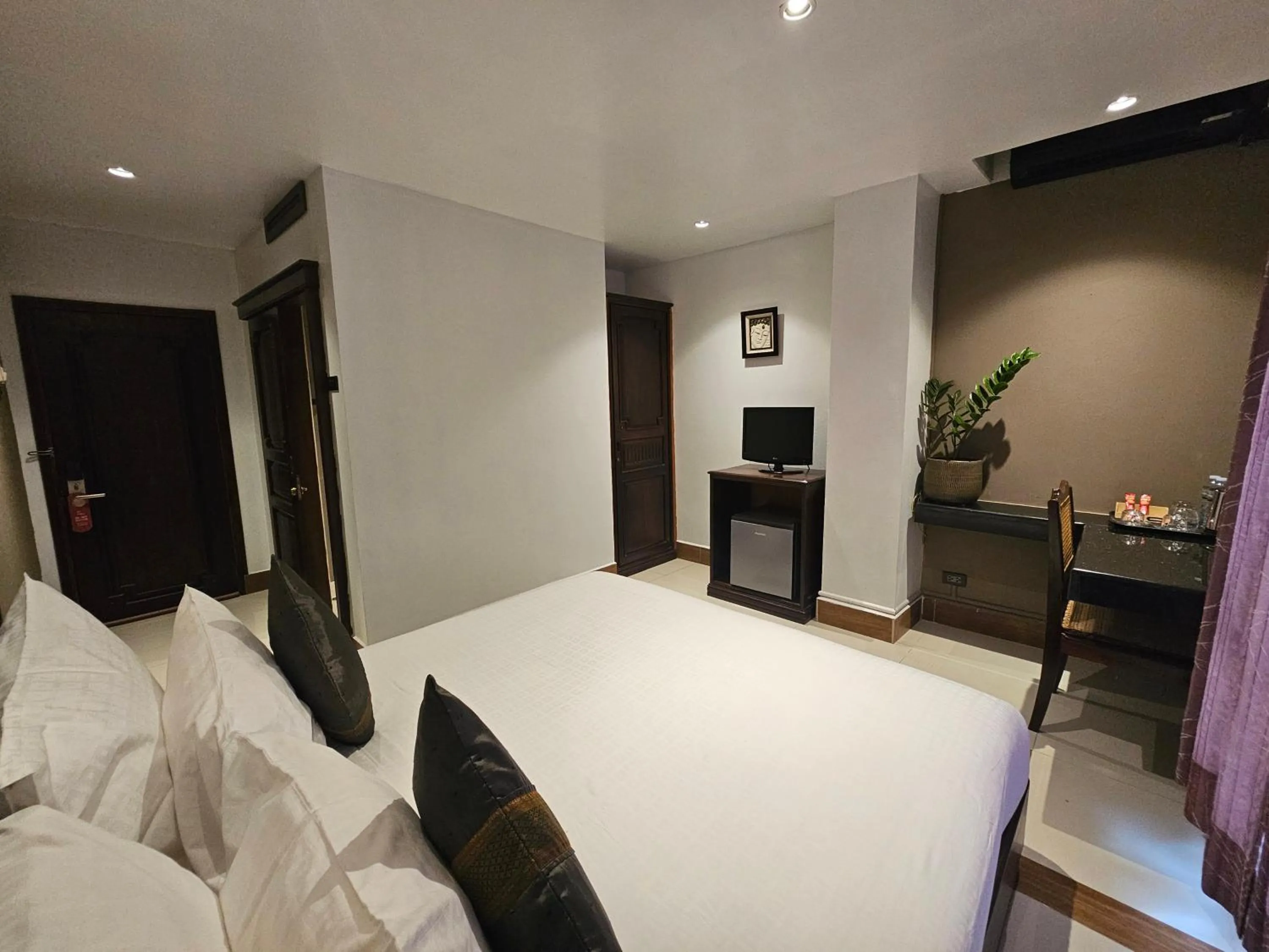 Bed in Family Boutique Hotel