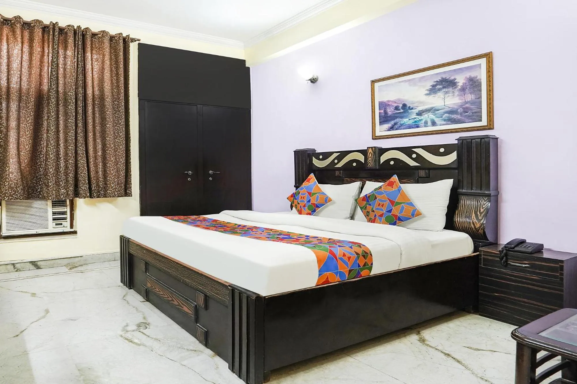 Bed in FabHotel Ivy Inn Sector 35