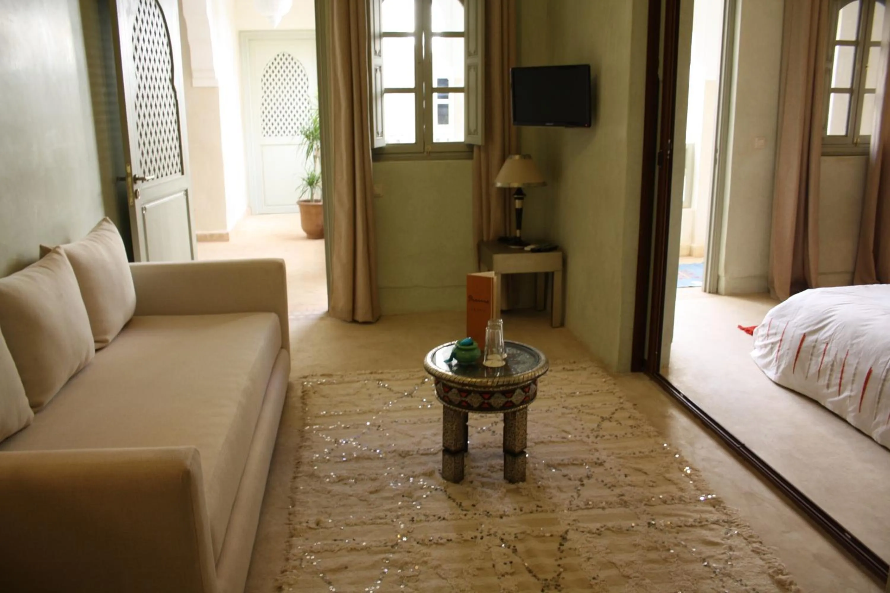 Seating area, Bed in Riad Shama Suites & Spa