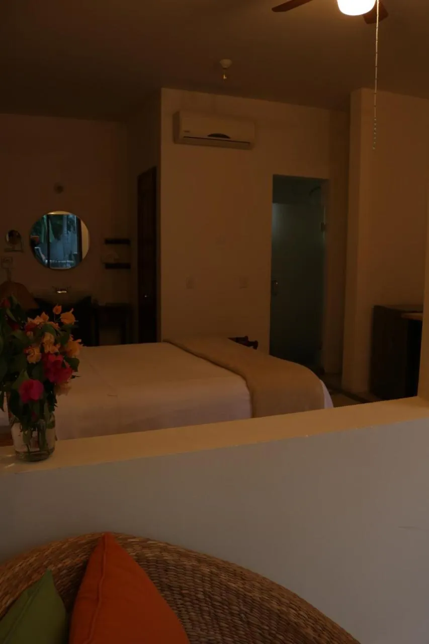 Photo of the whole room, Bed in Casa Bugambilias