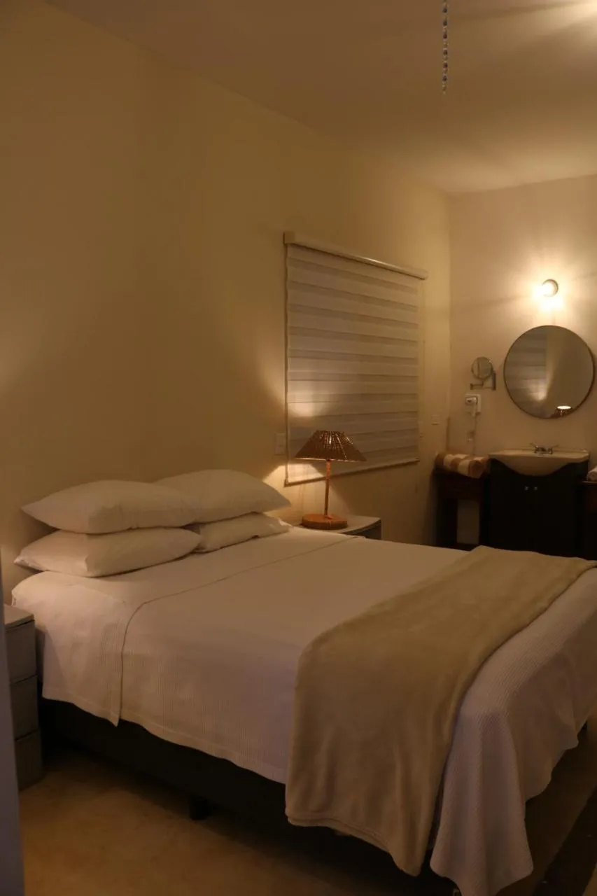 Photo of the whole room, Bed in Casa Bugambilias